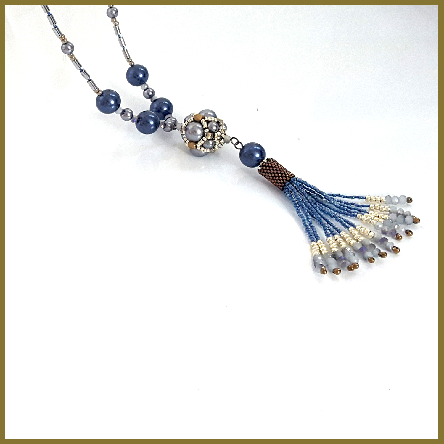 Blue beaded necklace with tassel.