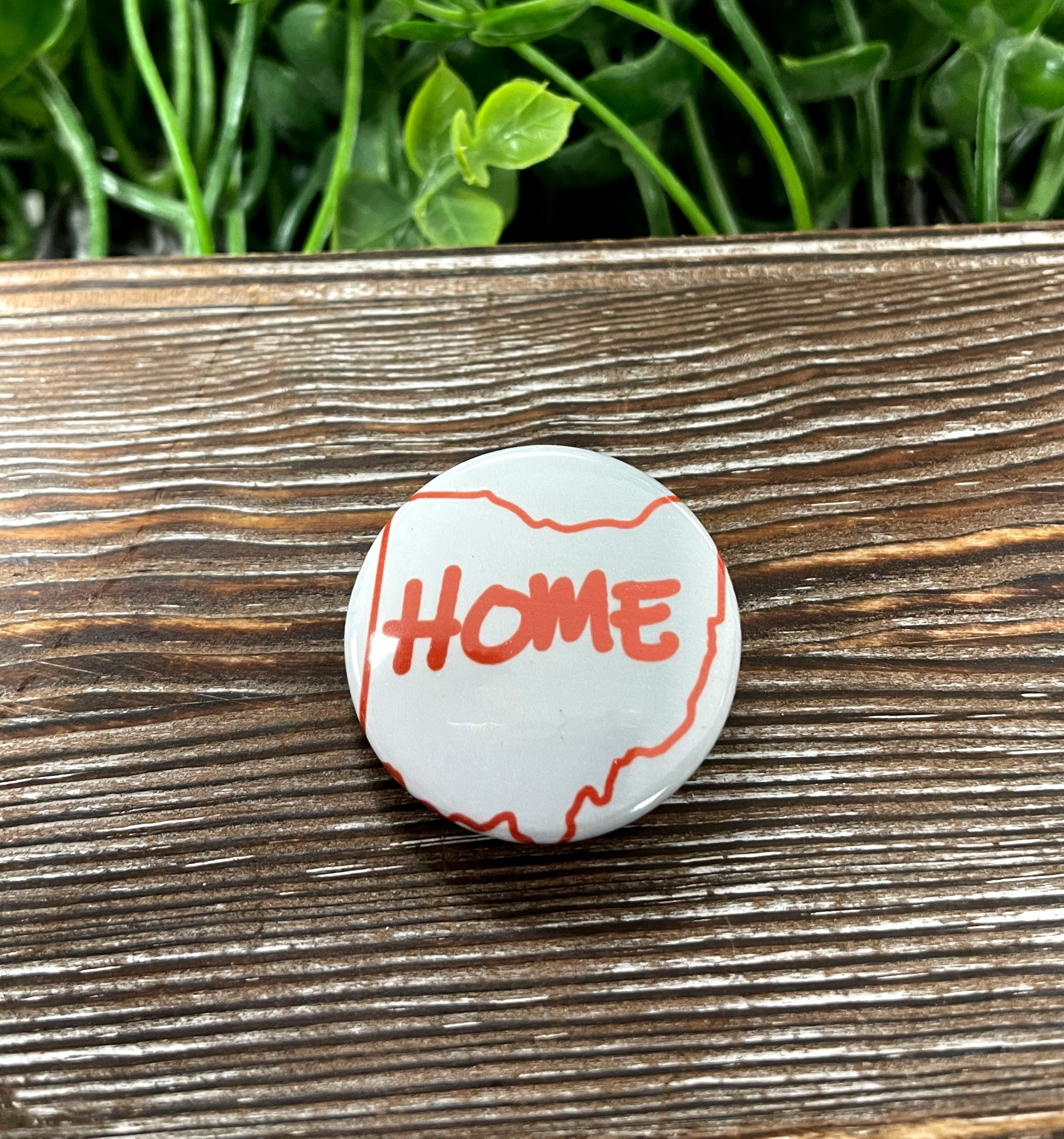 Ohio Red Home graphic art button pin, 1.25 inches, featuring vibrant design on a durable plastic back.