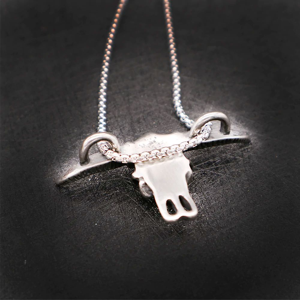 Ox Head Pendant Necklace made of stainless steel with a rope chain, featuring an intricate ox head design.