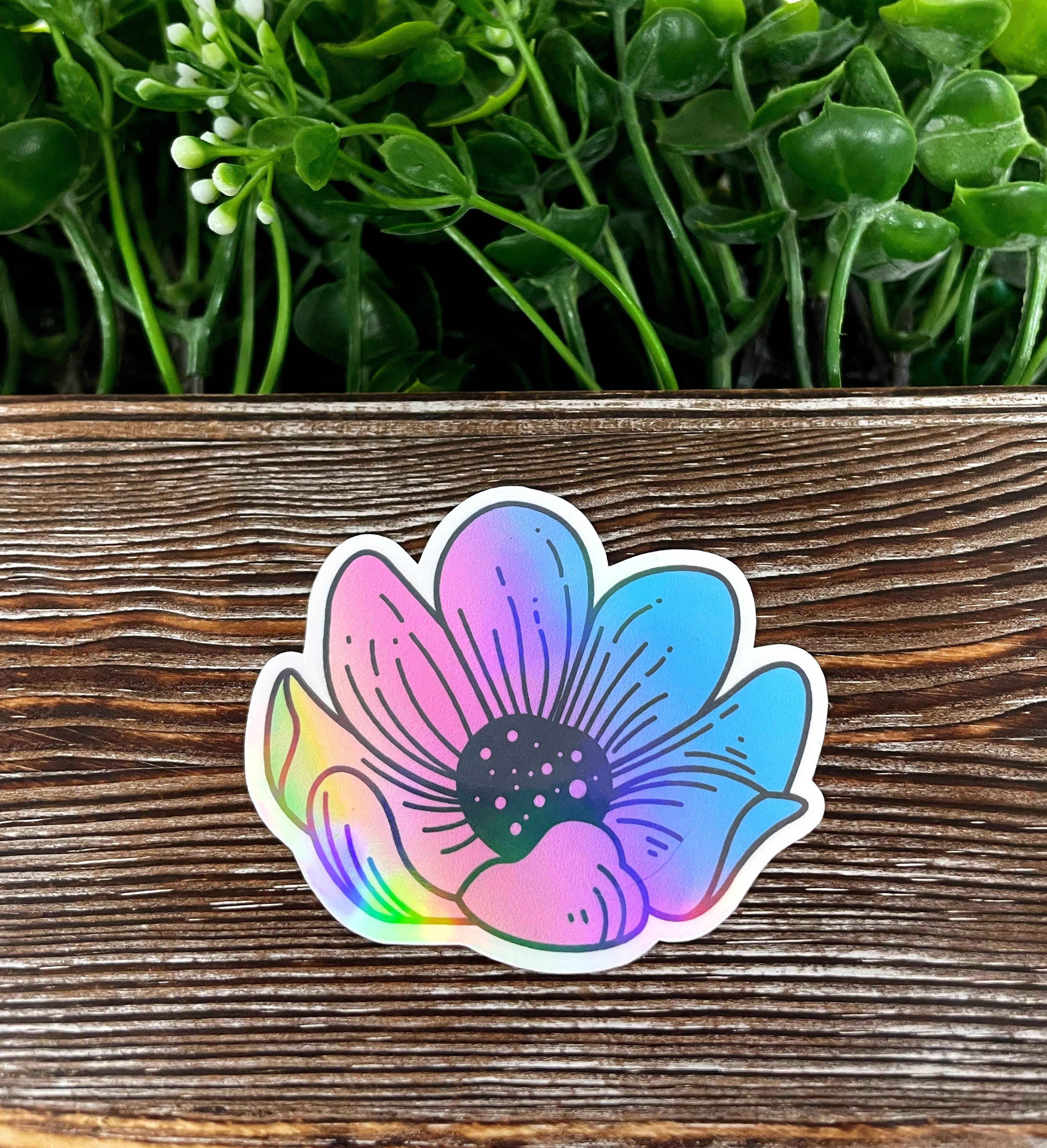 A vibrant pastel watercolor flower die cut vinyl sticker, showcasing intricate floral designs in soft colors, perfect for personalizing various surfaces.