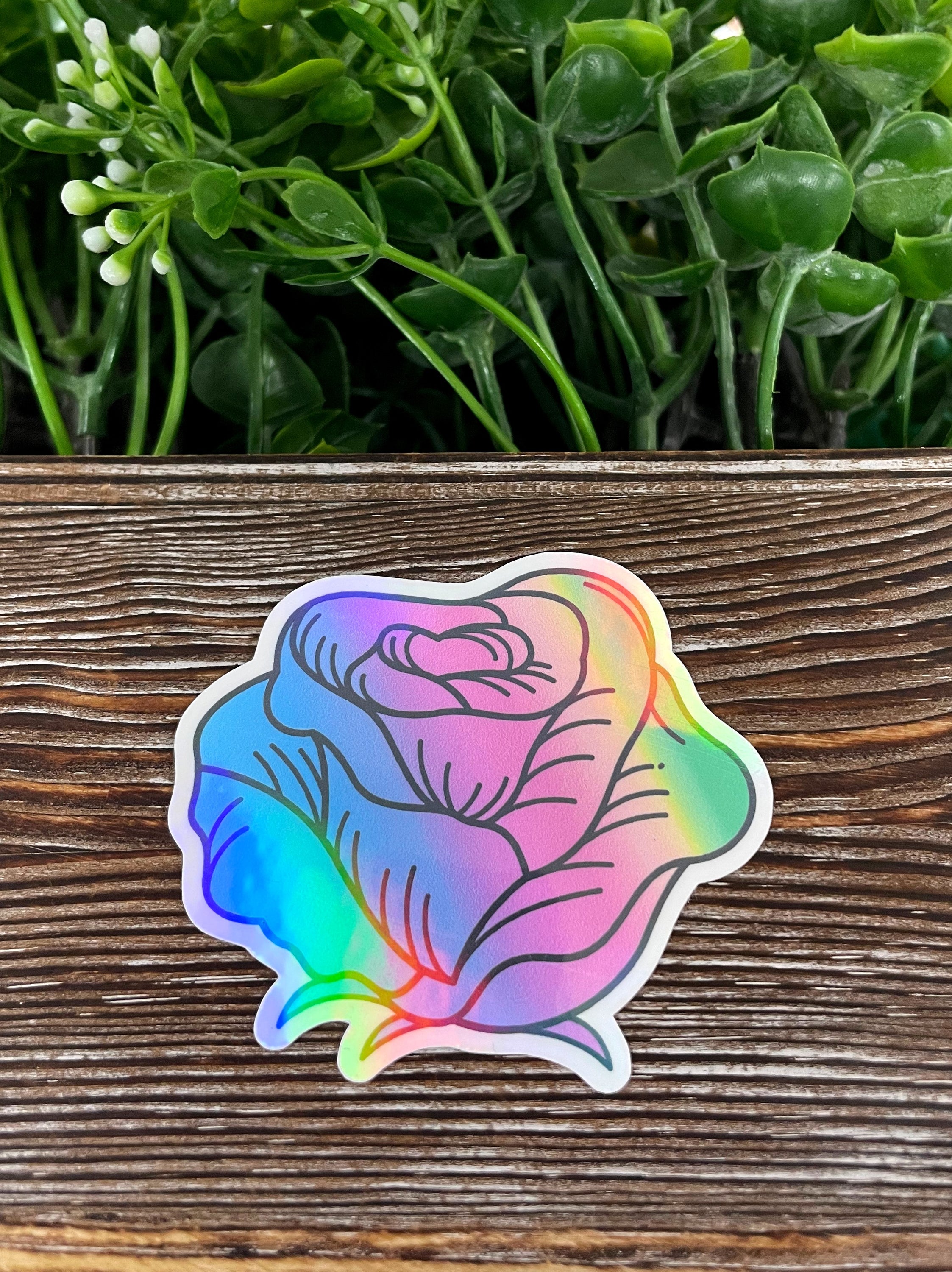 Pastel Watercolor Rose die cut vinyl sticker on a smooth surface, showcasing vibrant colors and intricate design.