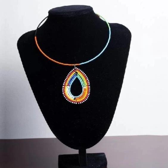 Colorful handmade Maasai beaded choker necklace with a unique pendant detail, showcasing vibrant beads in a traditional design.