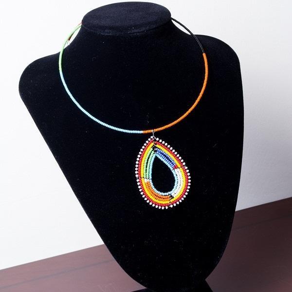 Colorful handmade Maasai beaded choker necklace with a unique pendant detail, showcasing vibrant beads in a traditional design.