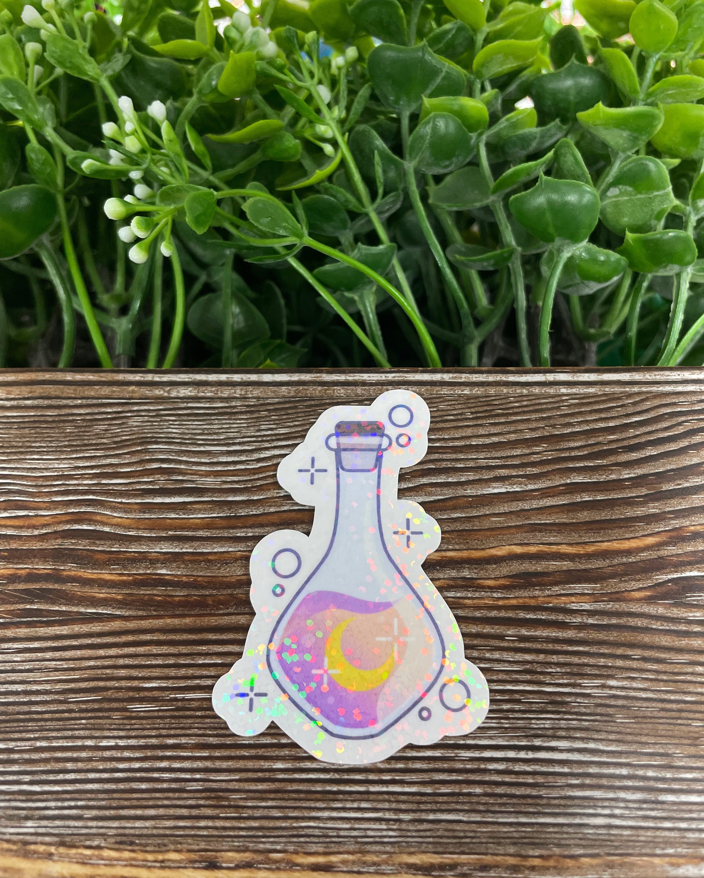 A vibrant purple potion bottle die cut vinyl sticker with a whimsical design, perfect for personalizing various smooth surfaces.