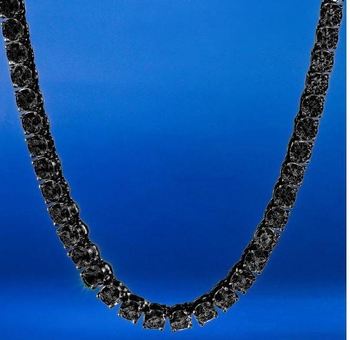 ROCK 4 MM One Row Tennis Chain featuring cubic zirconia stones on a brass metal base, elegantly displayed against a neutral background.