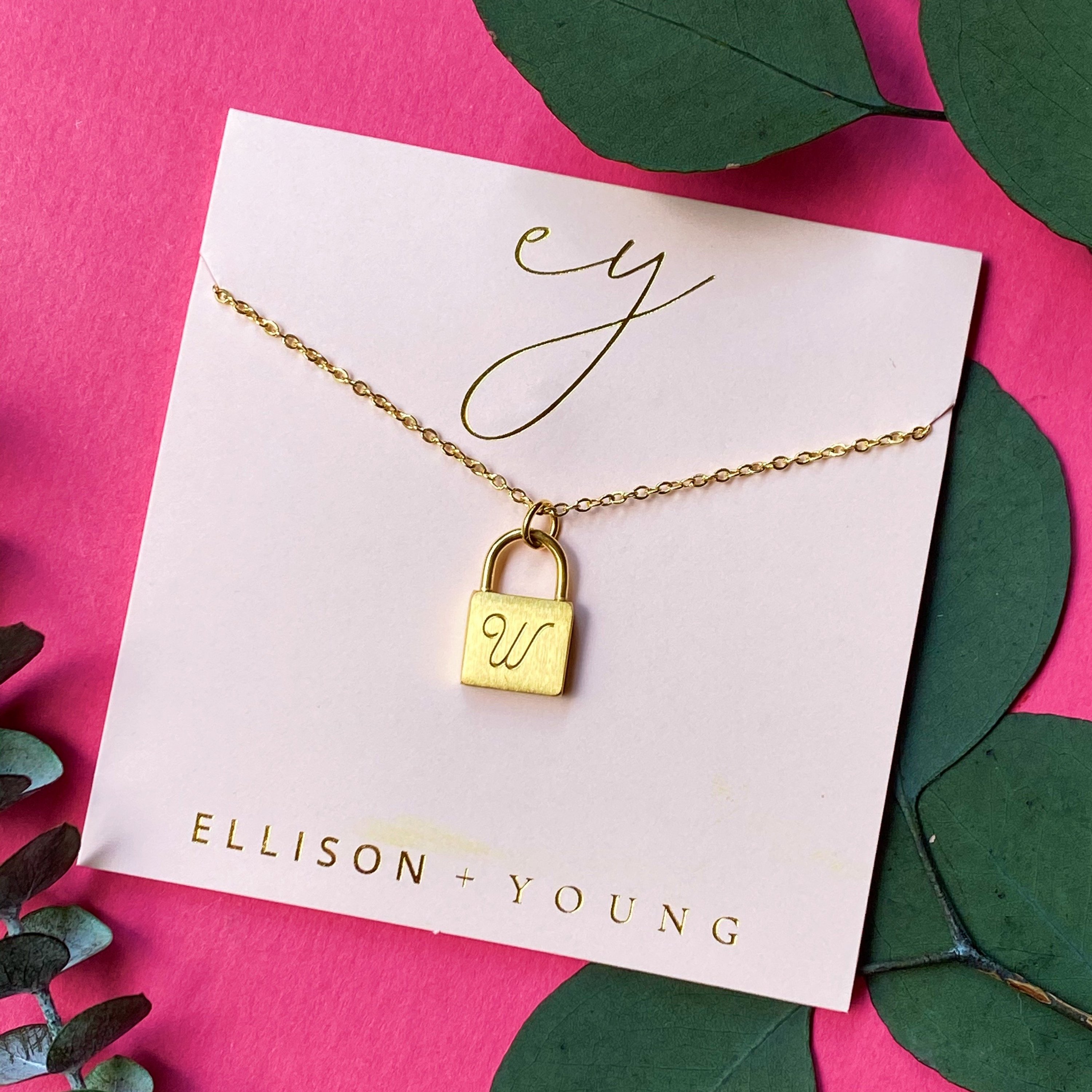 Elegant Scripted Notes Locket Initial Necklace with brushed finish and monogram initial.