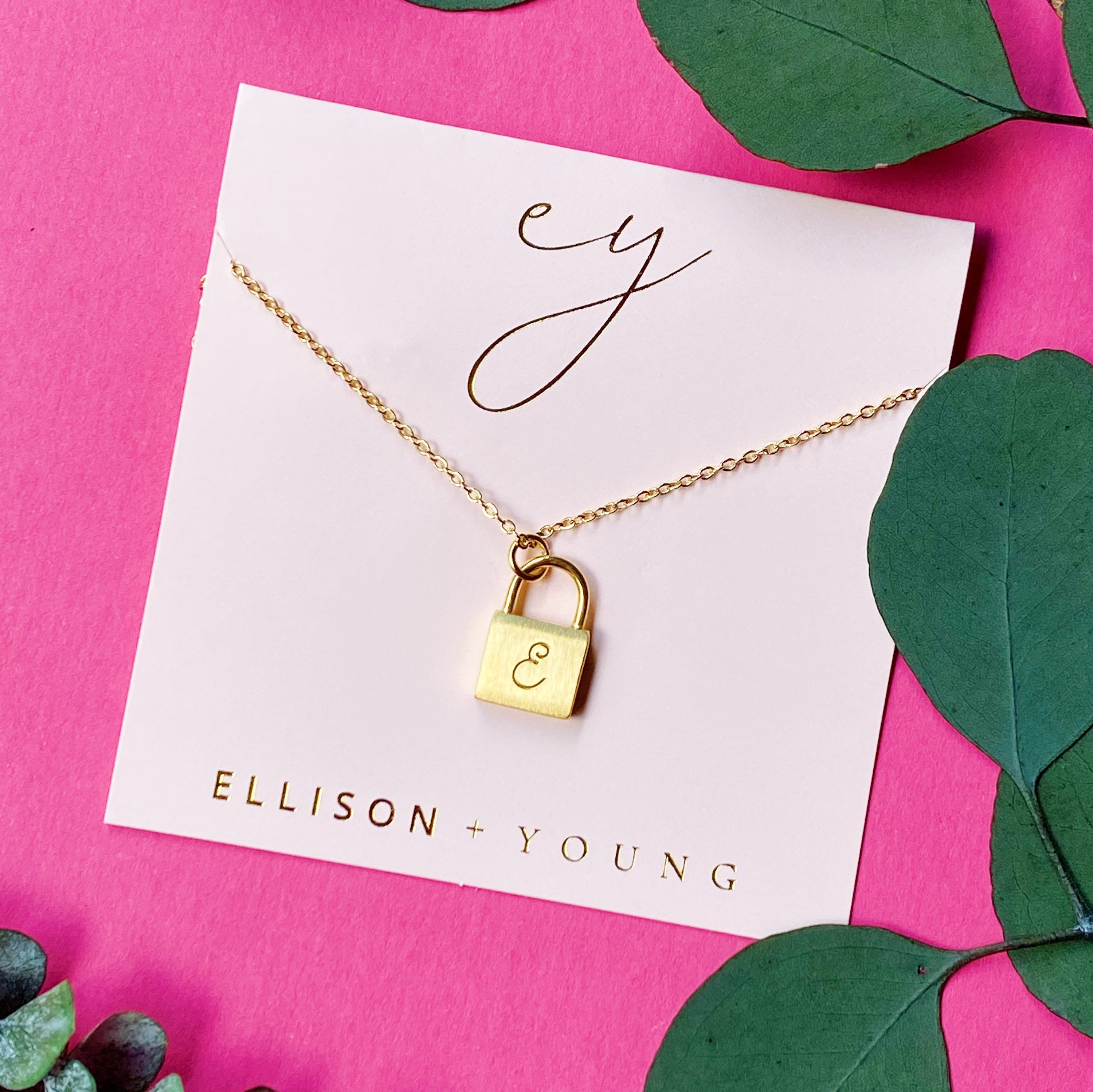 Elegant Scripted Notes Locket Initial Necklace with brushed finish and monogram initial.