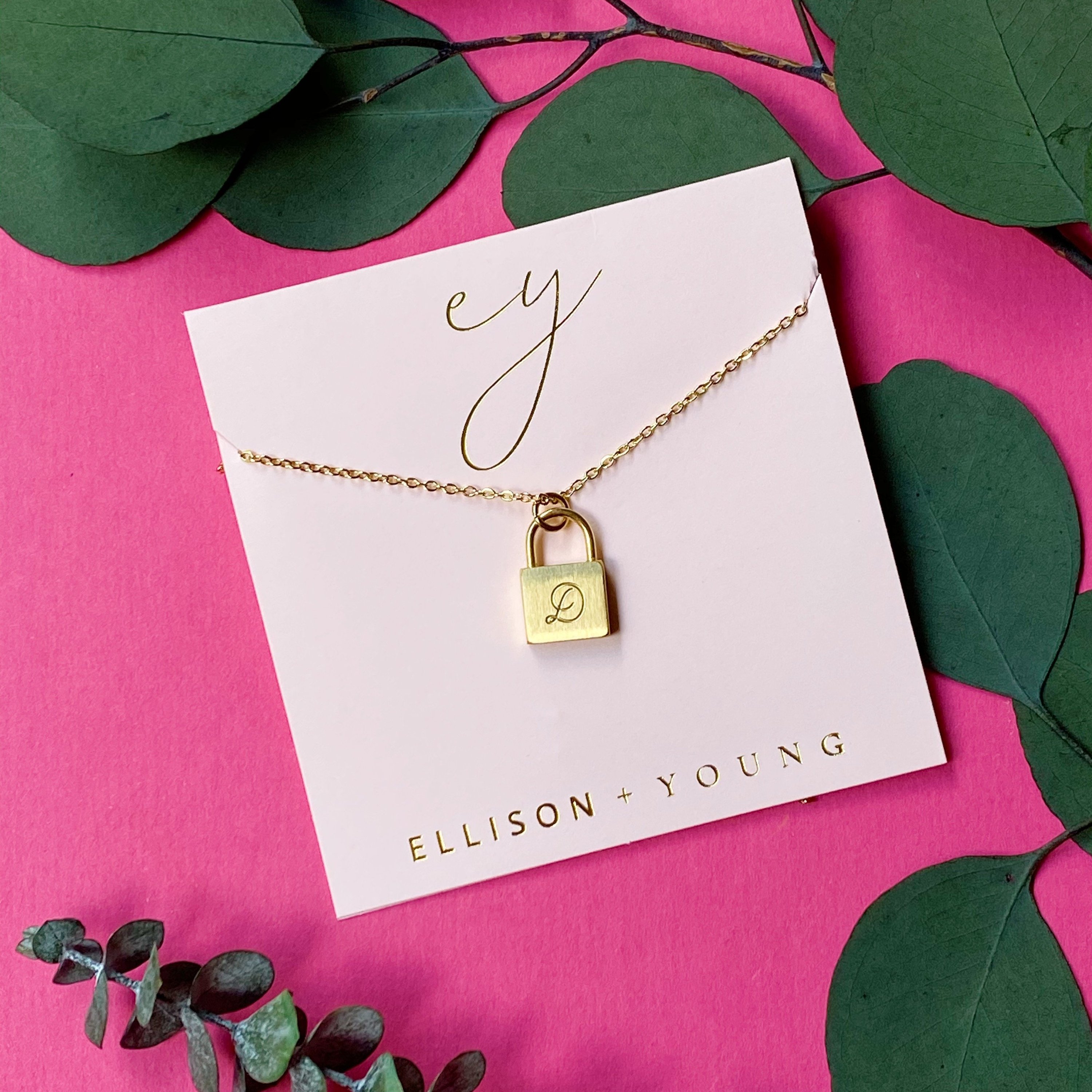 Elegant Scripted Notes Locket Initial Necklace with brushed finish and monogram initial.