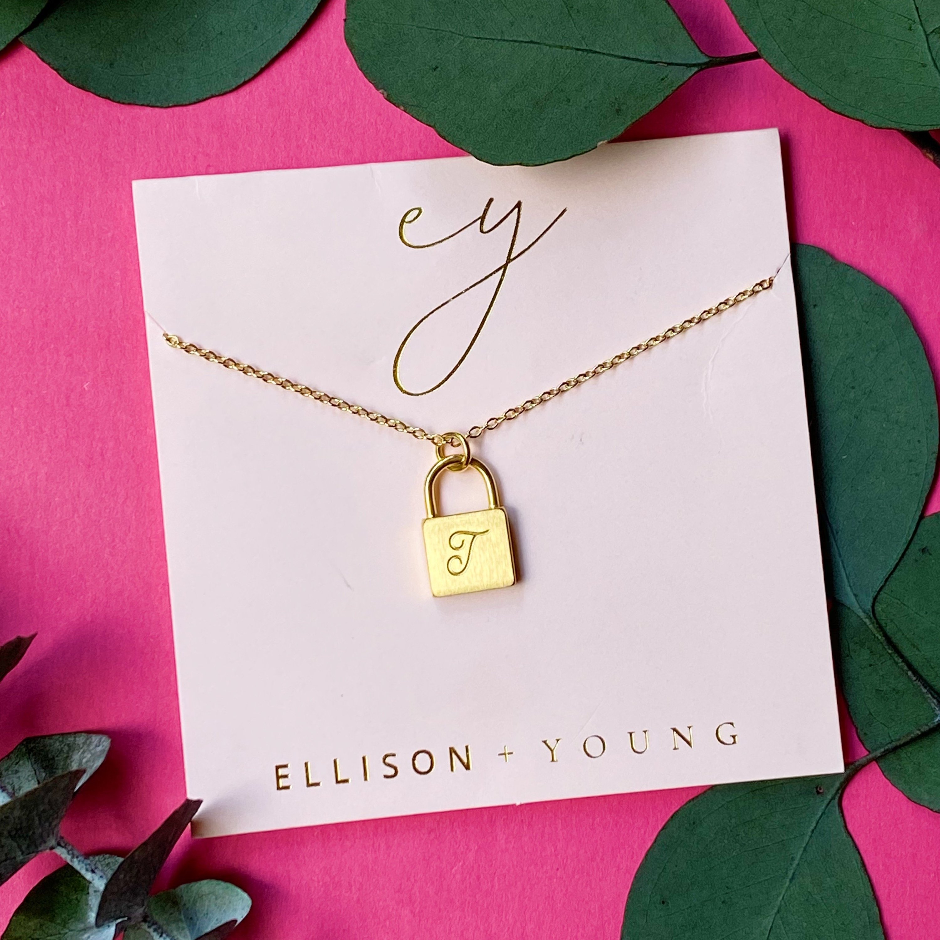 Elegant Scripted Notes Locket Initial Necklace with brushed finish and monogram initial.