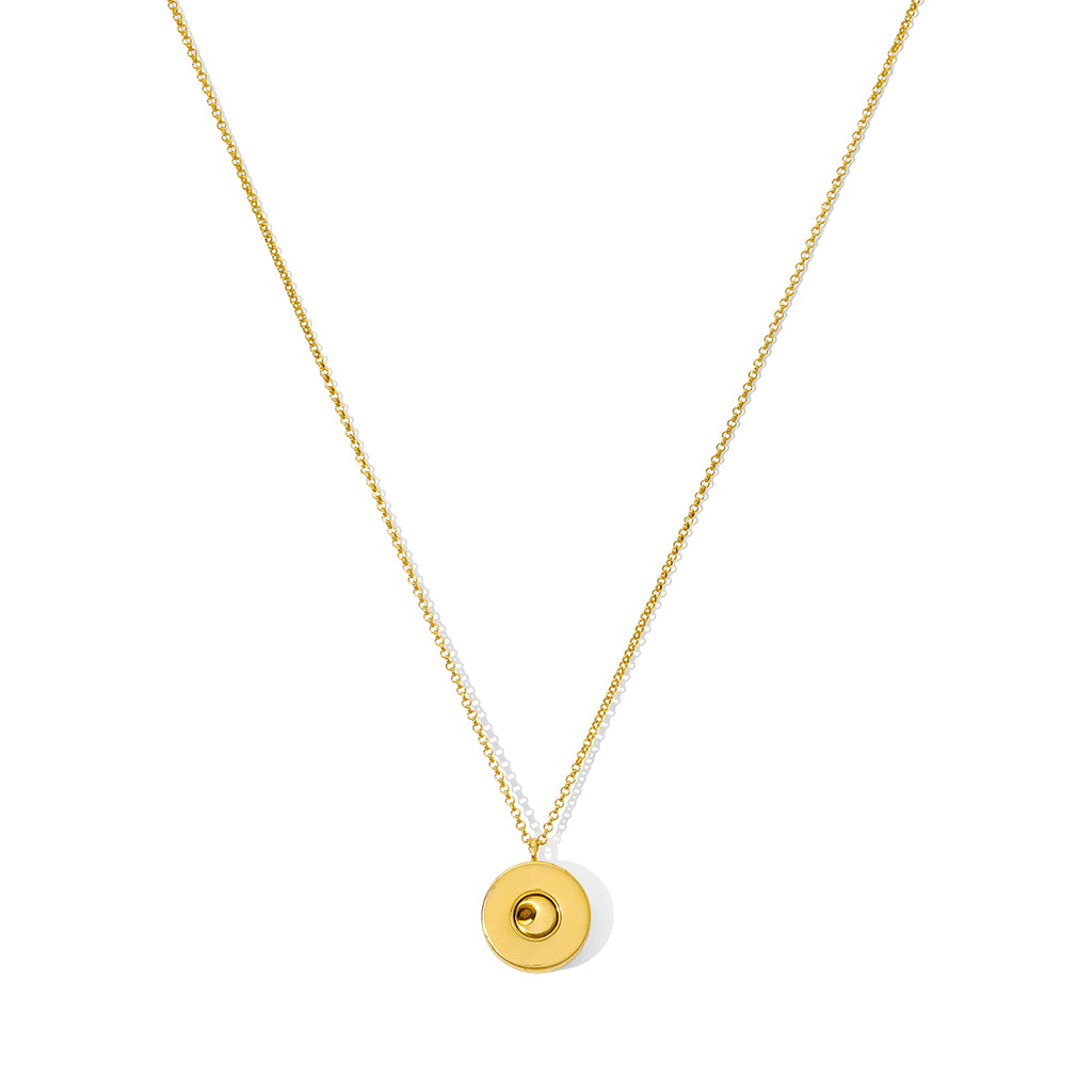 A stylish Shell Casing Pendant Necklace made from recycled bullet casings, featuring a gold plated chain, showcasing unique craftsmanship.