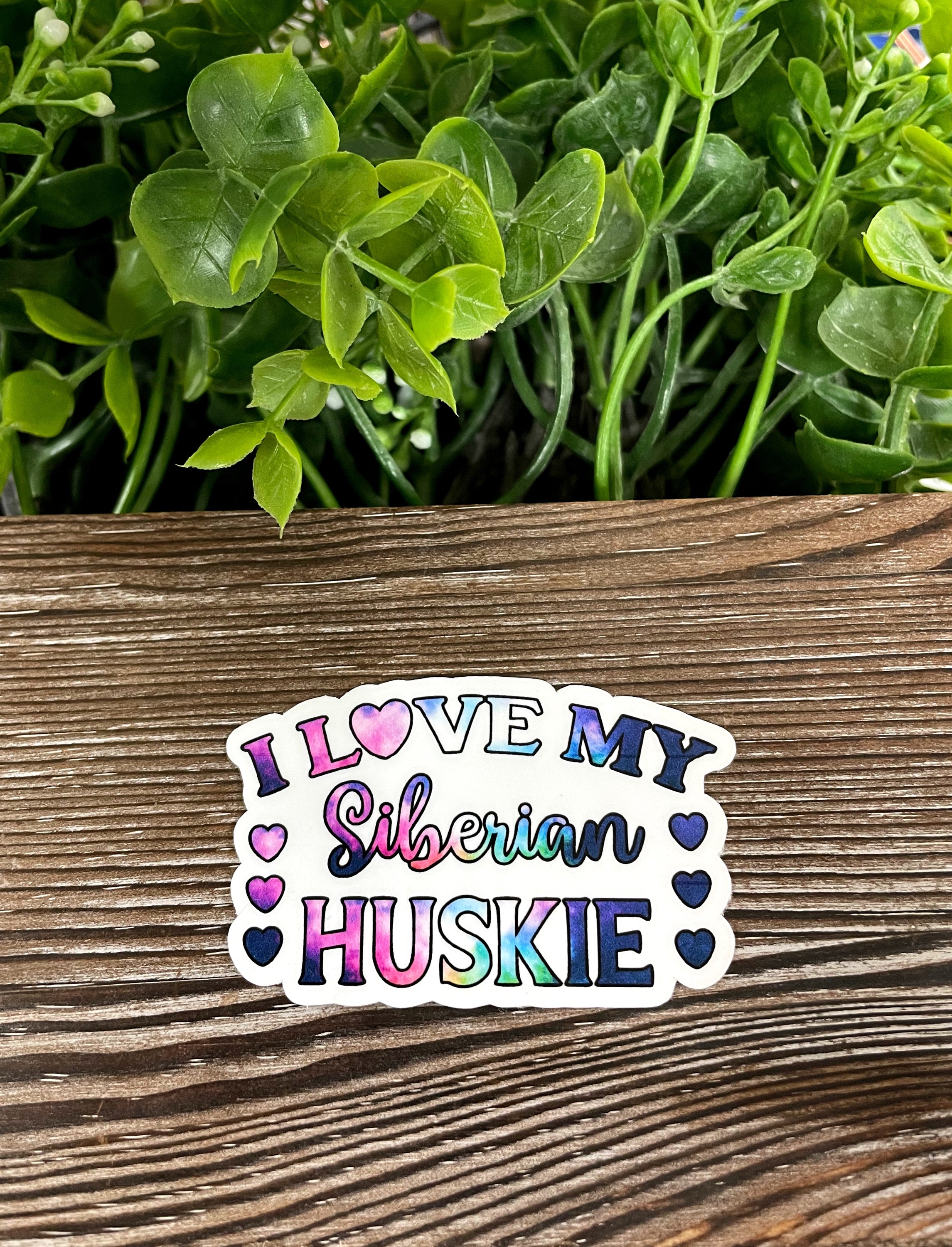 Siberian Huskie die cut vinyl sticker with a vibrant galaxy pattern, showcasing a beautiful design perfect for personalizing items.