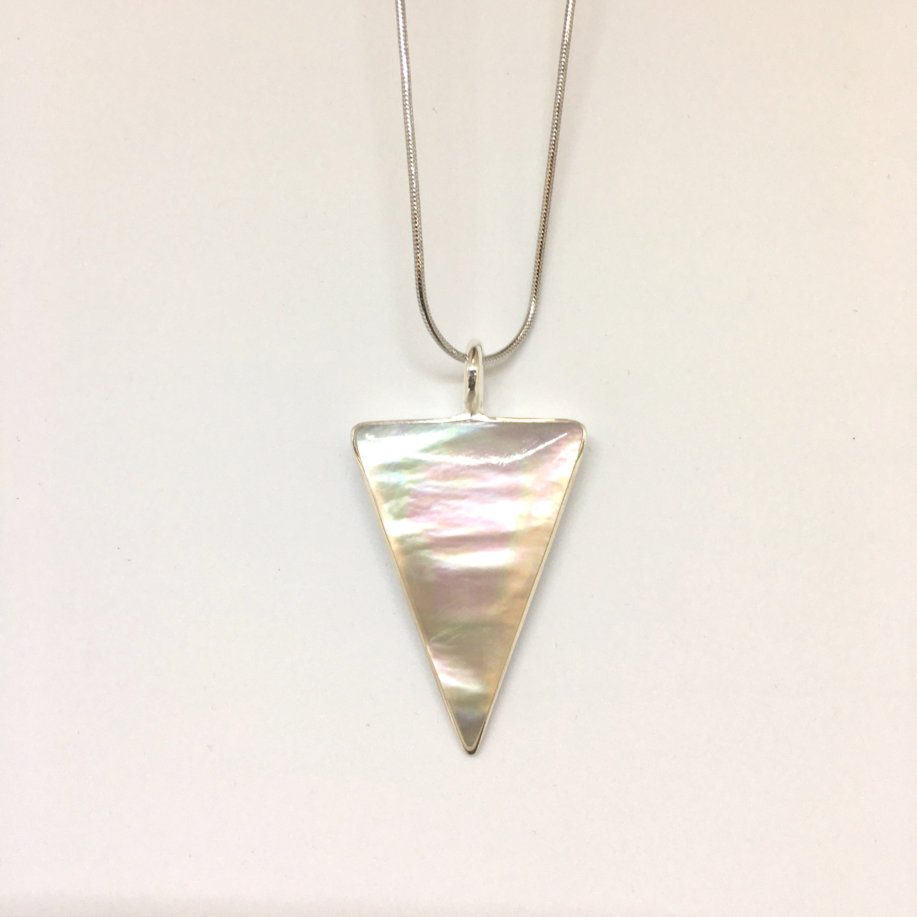 Elegant Silver Mother Of Pearl Necklace featuring a triangle design, crafted from 925 sterling silver, showcasing a beautiful iridescent stone.