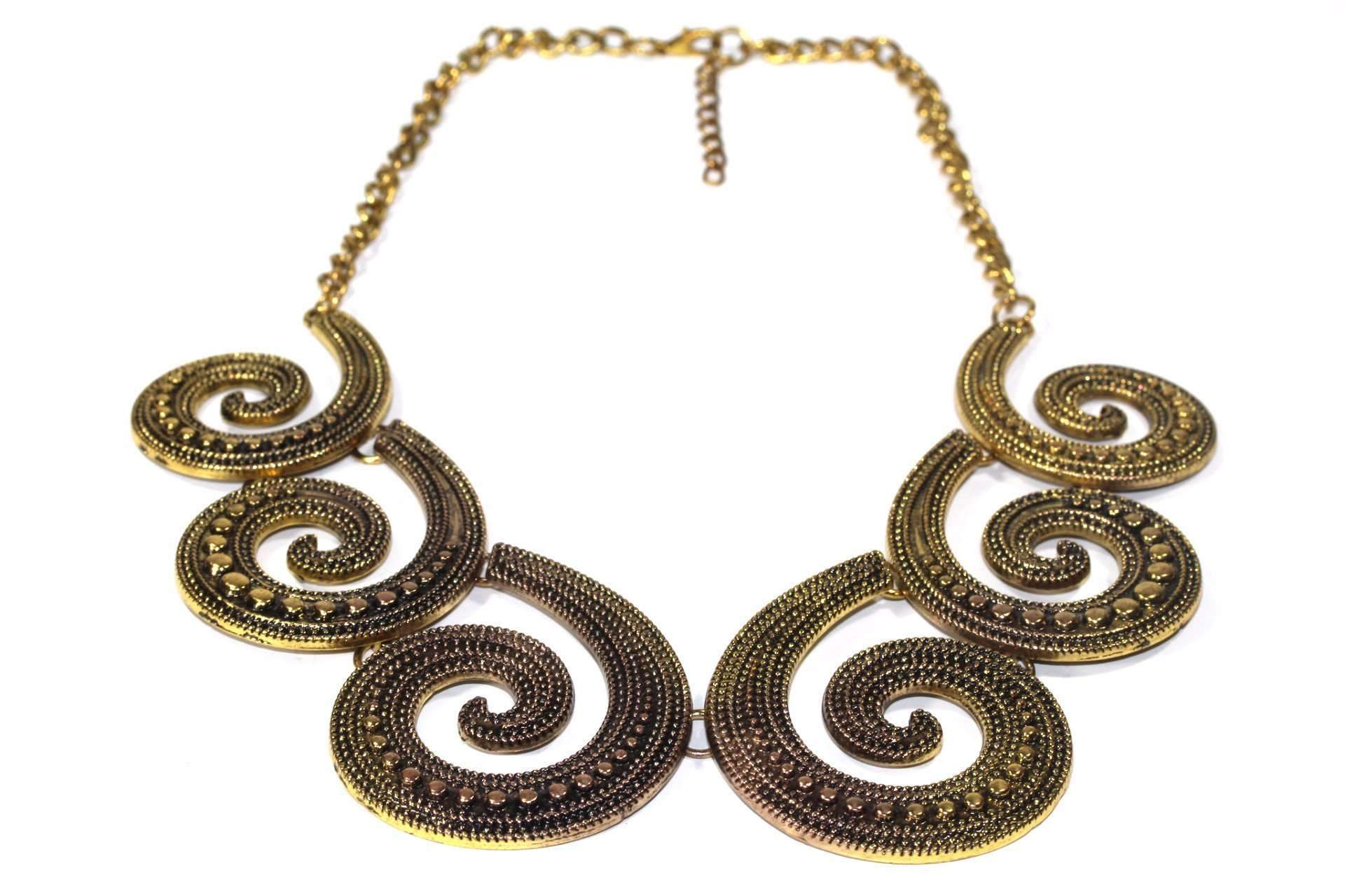 A stunning two-tone metal statement necklace featuring gold and antique gold spirals with intricate scroll-work and round drops.