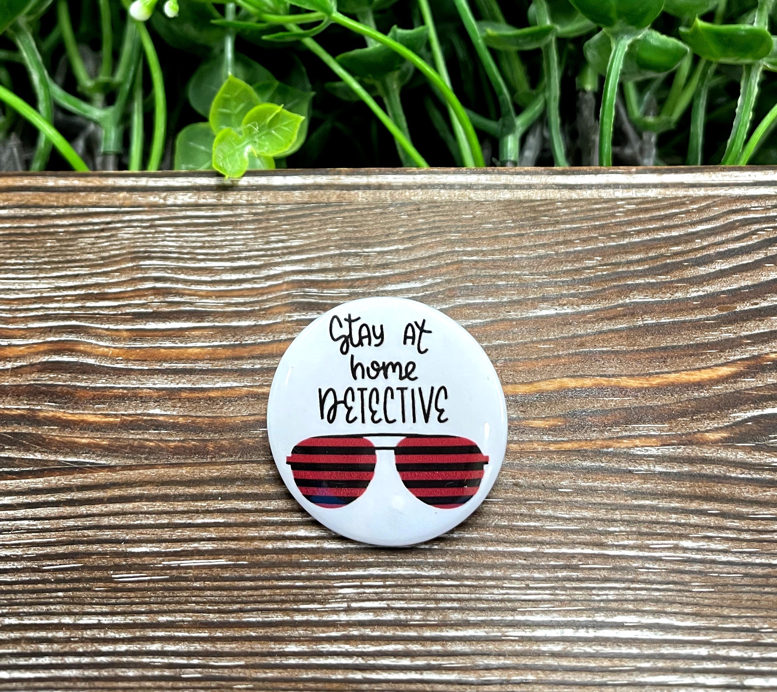 Stay at Home Detective True Crime Graphic Art Button, 1.25 inches, featuring a unique design perfect for bags and masks.