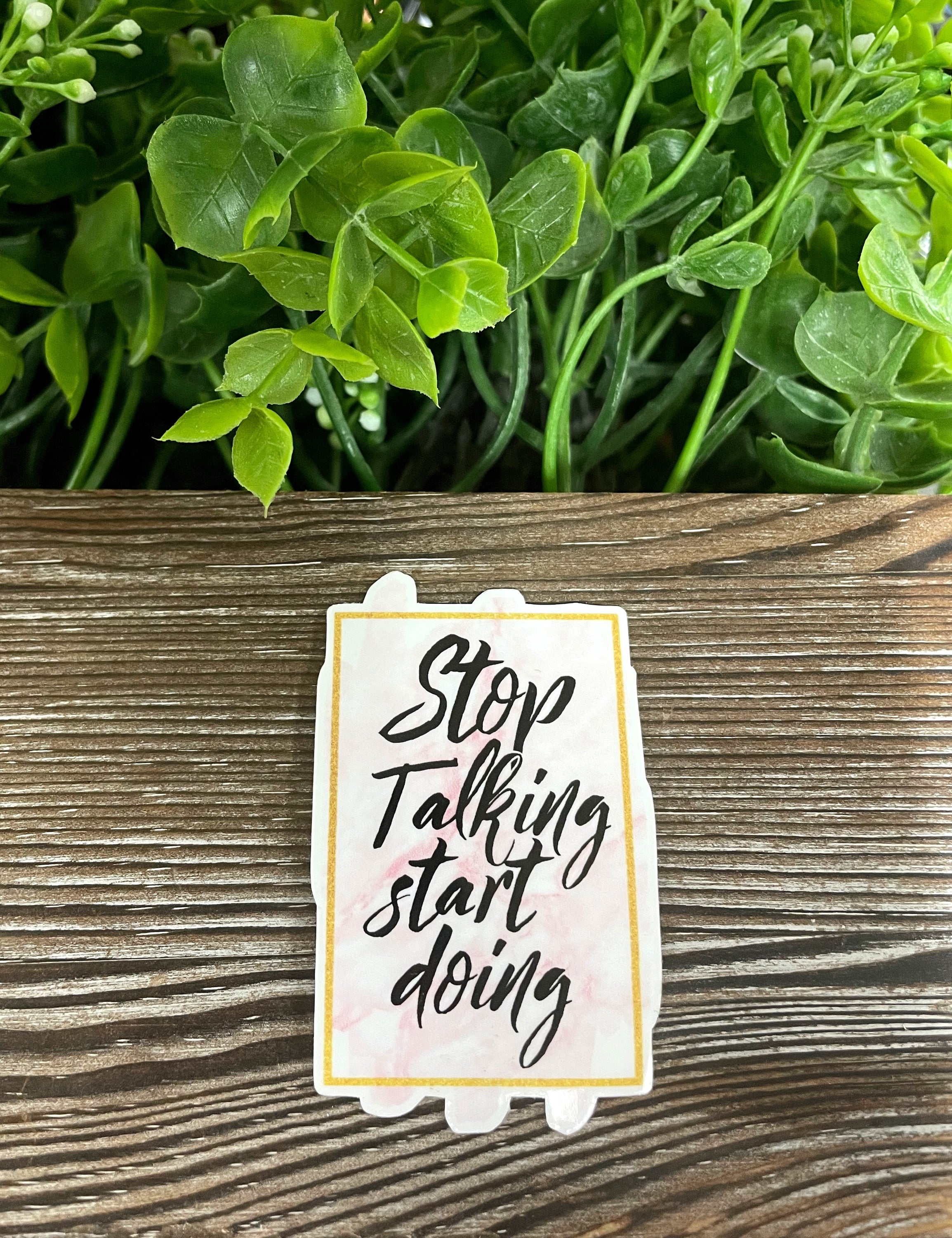 A vibrant Stop Talking Start Doing Sticker displayed on a smooth surface, showcasing its motivational message and colorful design.