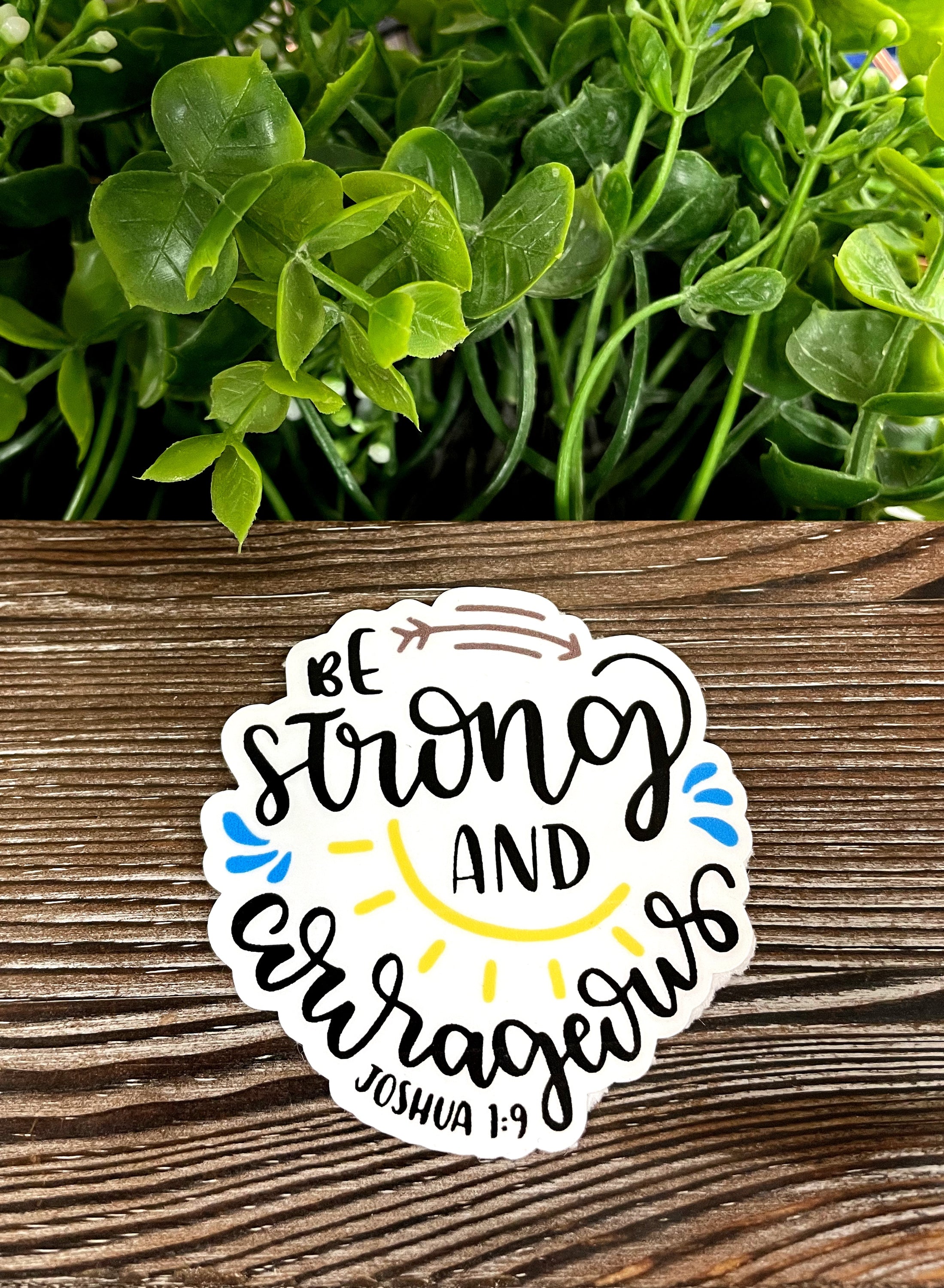 Strong and Courageous Sticker featuring Joshua 1:9, showcasing vibrant colors and a die cut design, perfect for personalizing various surfaces.