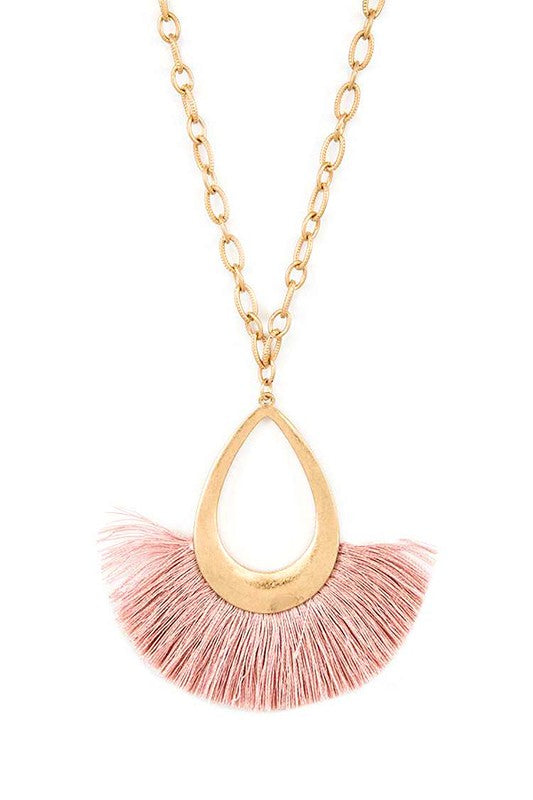 A stylish tassel teardrop pendant necklace featuring a long chain, perfect for adding elegance to any outfit.