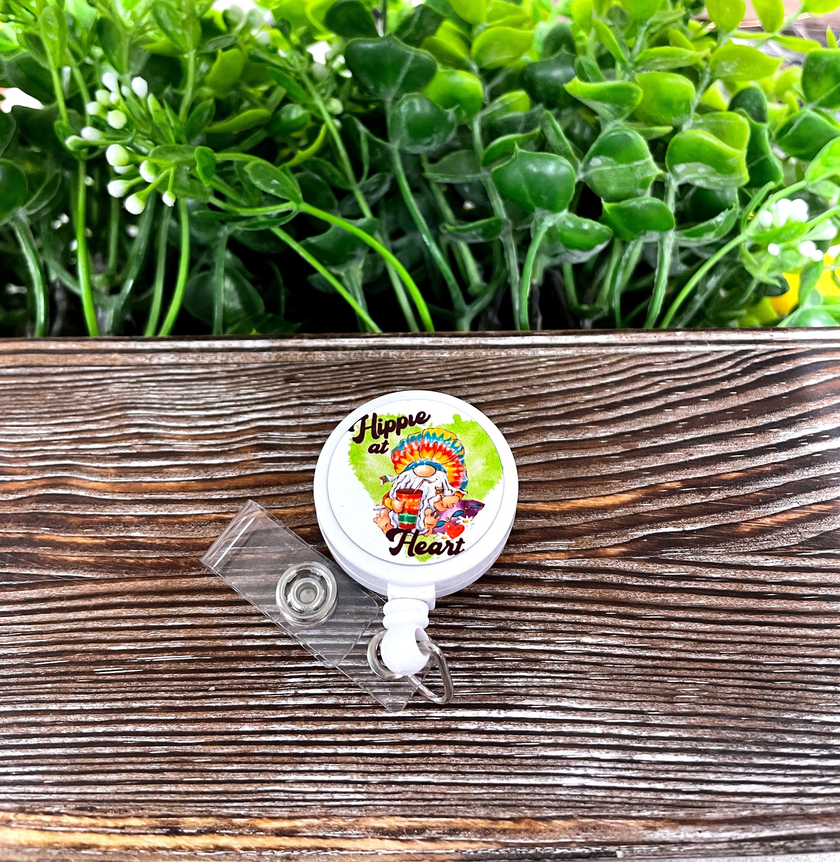 A vibrant tie-dye retractable badge reel featuring a bohemian design, measuring 1.2 inches in diameter with a 24-inch extension cord.