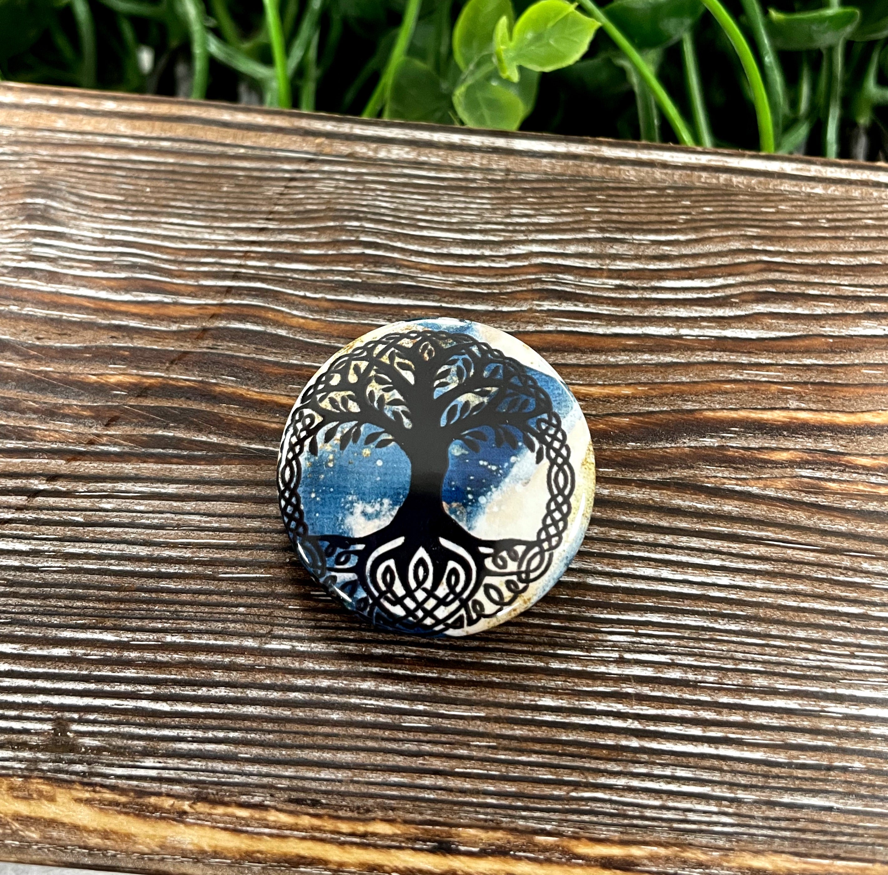 Tree of Life button pin featuring blue and gold glitter design, measuring 1.25 inches in diameter.