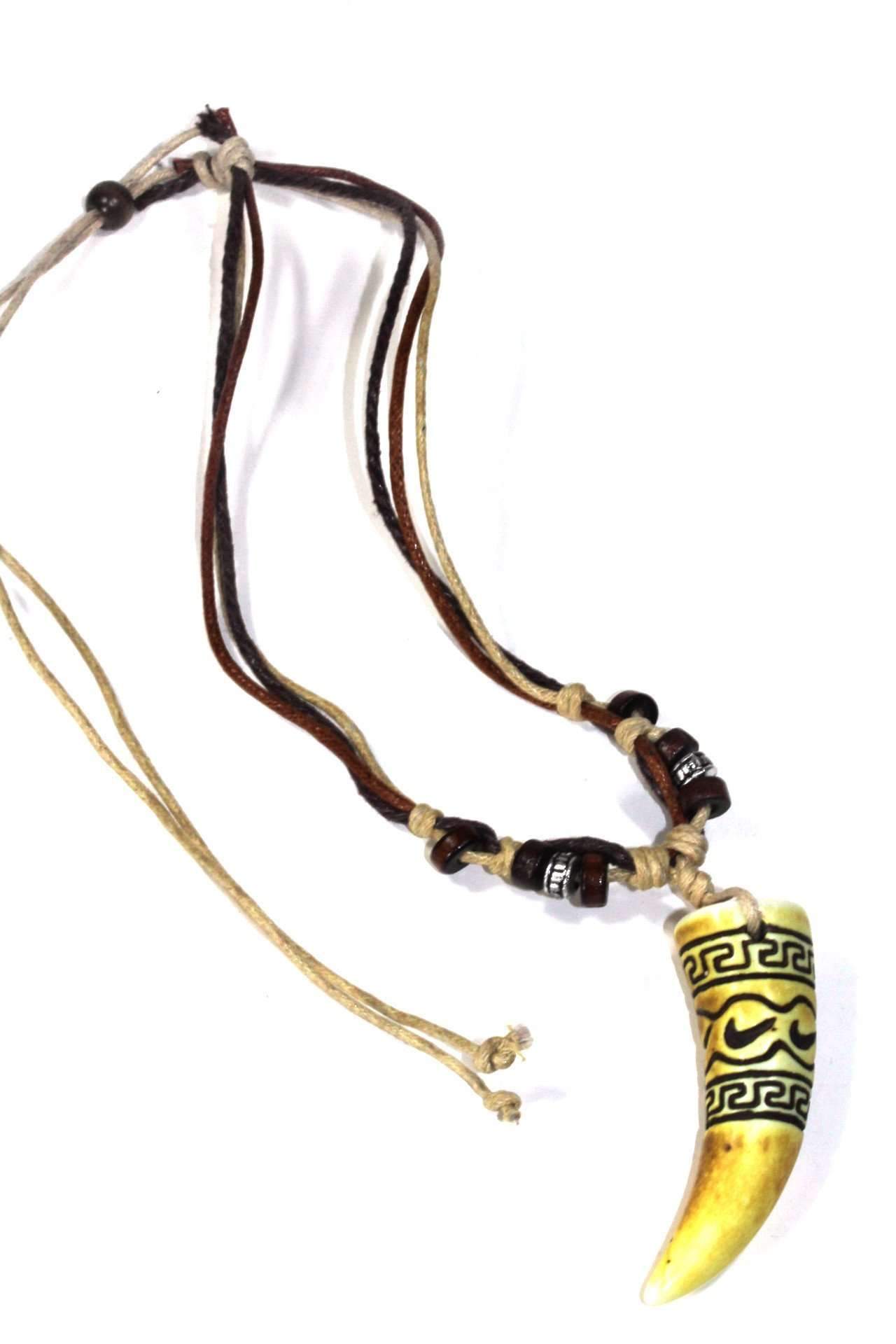 Tribal Carved Tusk Boho Style Necklace featuring a carved tusk pendant, tri-color cord, wooden beads, and silver-tone charms.