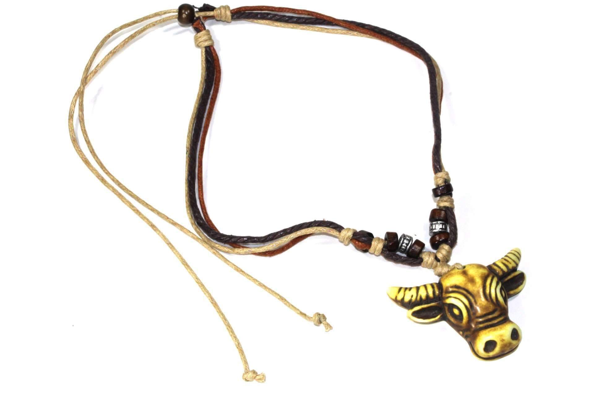 Tribal Cow Head Boho Style Necklace featuring a tri-color cord with wooden beads and a detailed cow head pendant.