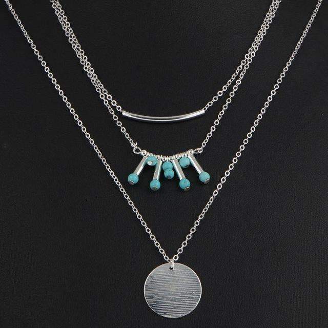 A beautiful turquoise multilayer necklace featuring three layers of turquoise beads and a high-quality zinc alloy chain, perfect for any outfit.