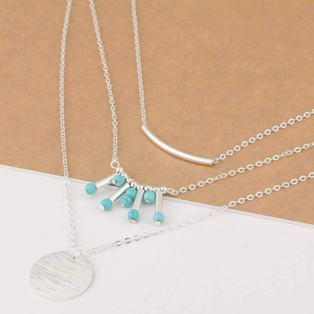 A beautiful turquoise multilayer necklace featuring three layers of turquoise beads and a high-quality zinc alloy chain, perfect for any outfit.