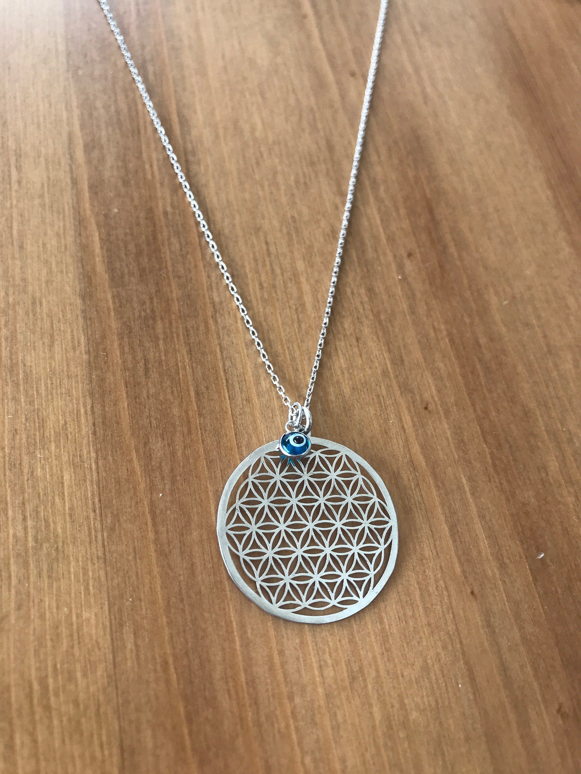 Unisex 925 Sterling Silver Flower of Life Necklace showcasing intricate design and high-quality craftsmanship.