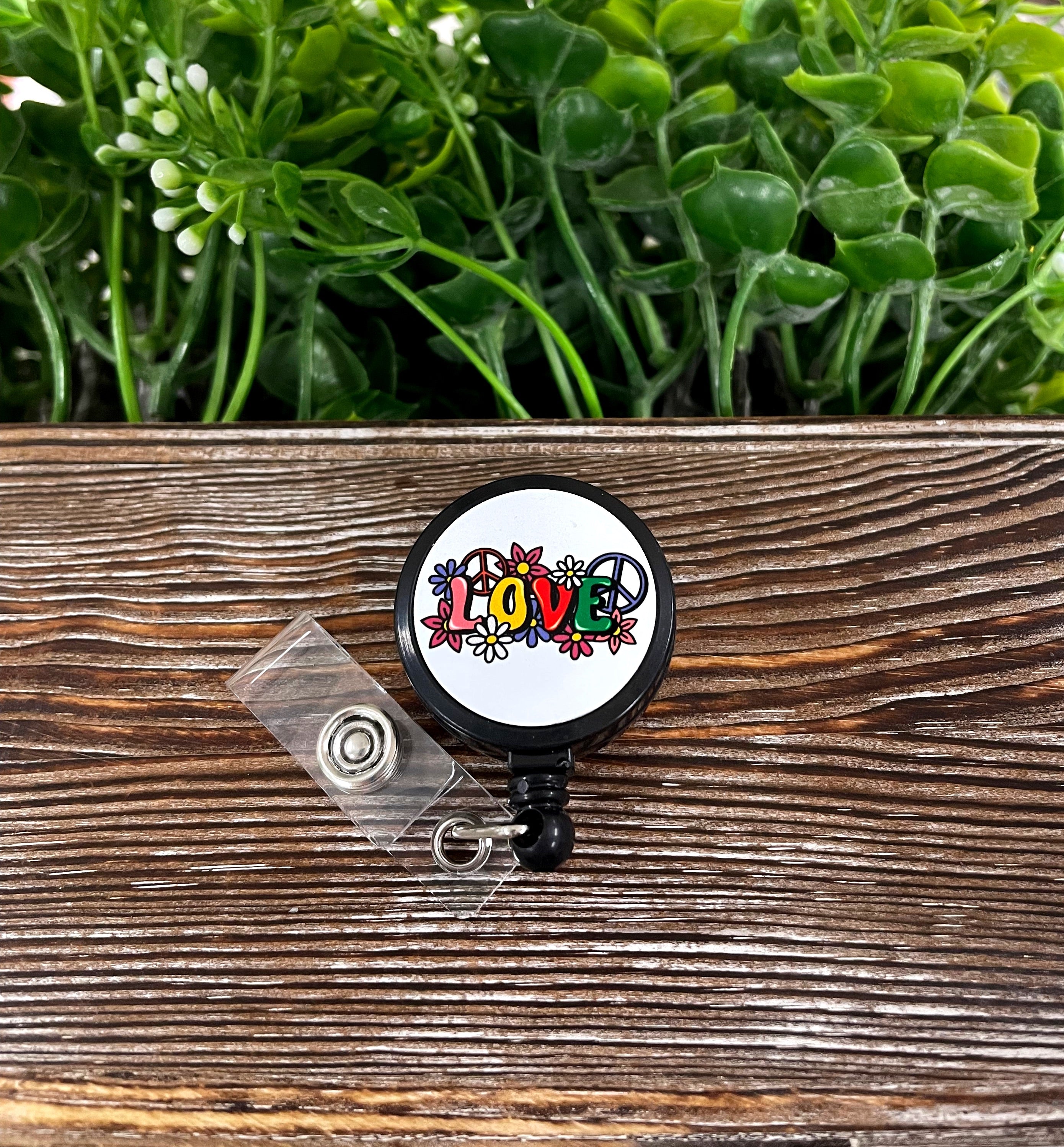 Vintage LOVE Hippie Retractable Badge Reel with a colorful boho design, featuring a 24-inch retractable cord and a metal base.