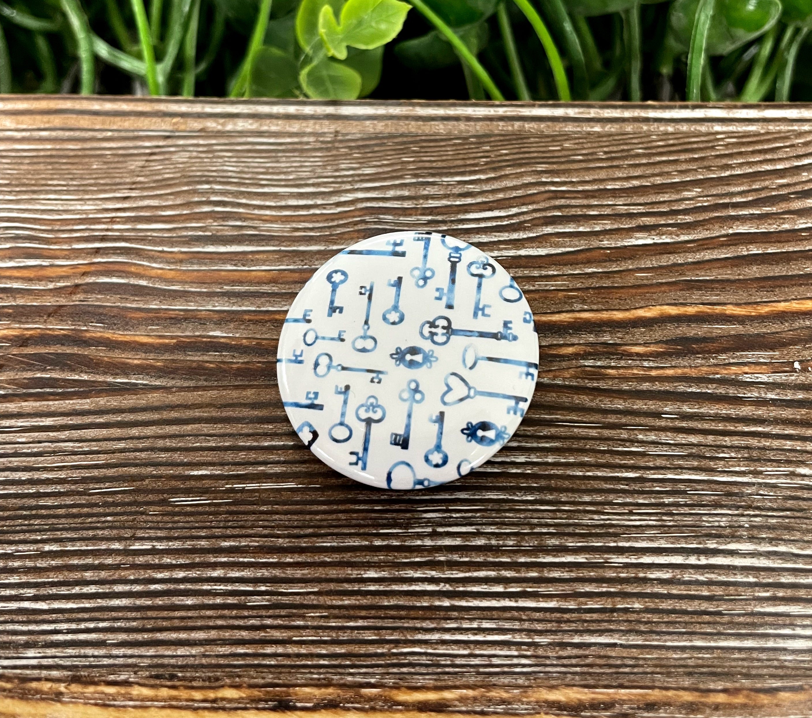 Vintage Skeleton Keys graphic art button, 1.25 inches, featuring a unique design perfect for personalizing accessories.