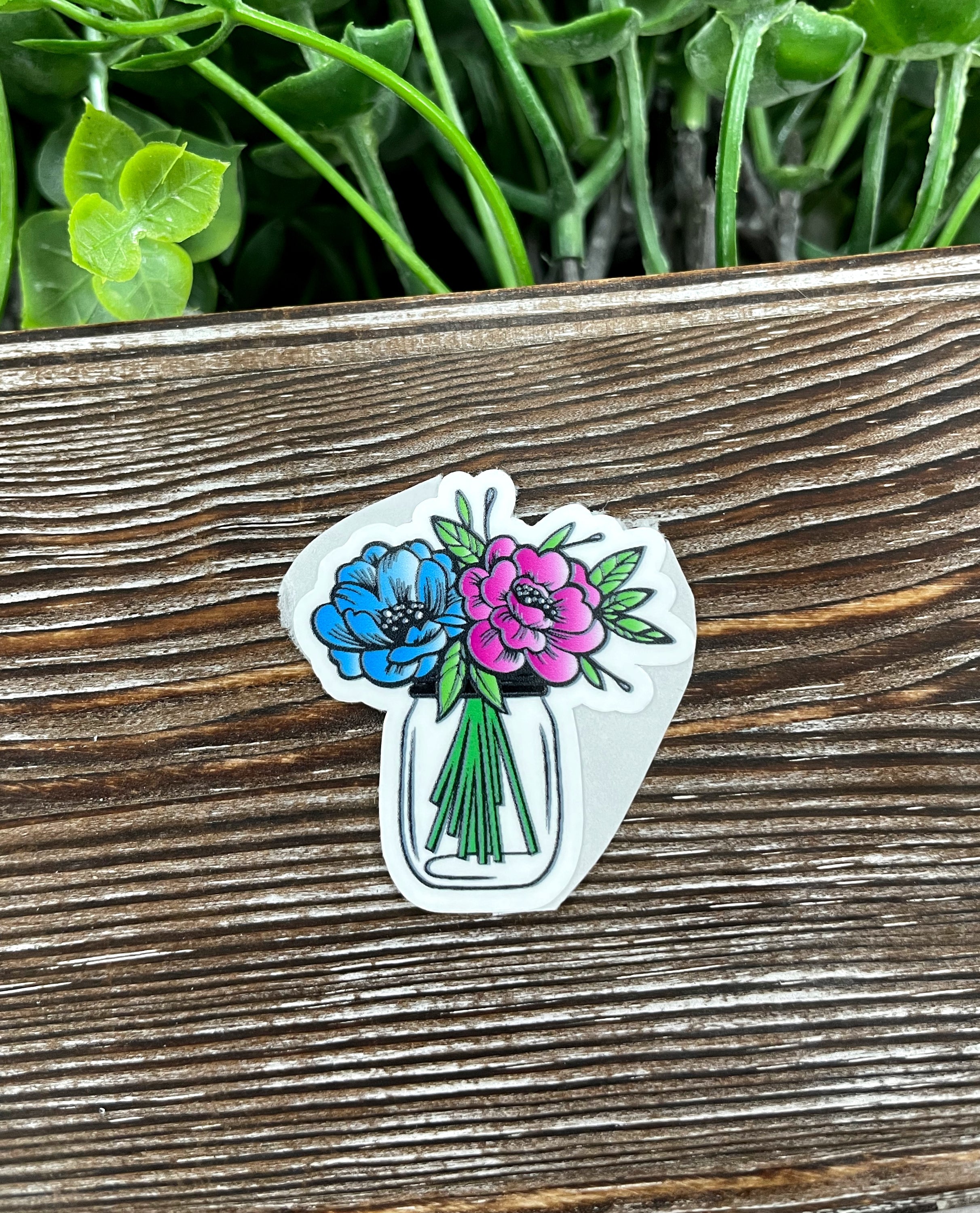 A vibrant watercolor flowers jar die cut sticker showcasing colorful floral designs on a white background, perfect for personalizing items.