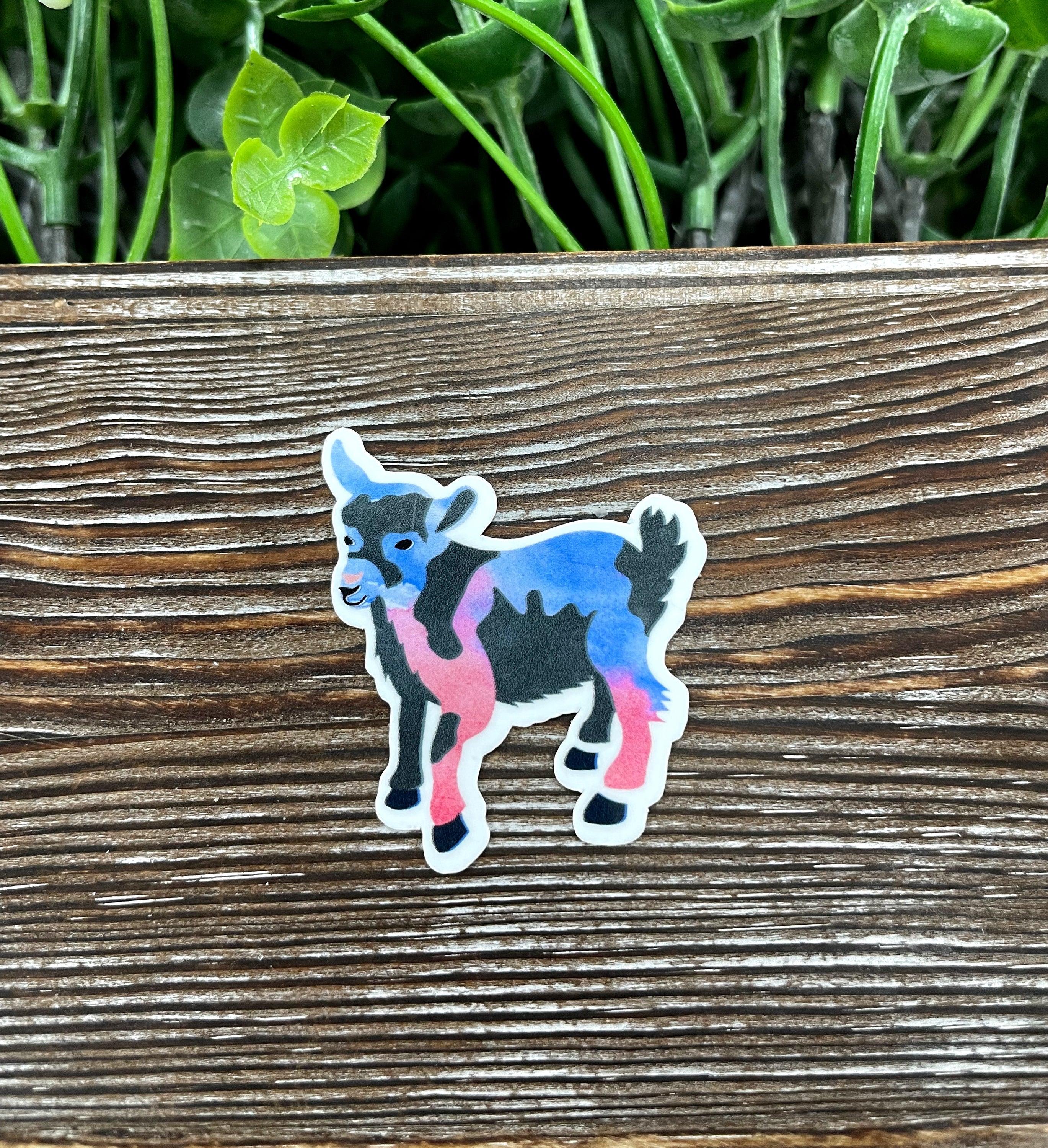 A vibrant watercolor goat die cut sticker showcasing intricate details and colors, perfect for personalizing various surfaces.