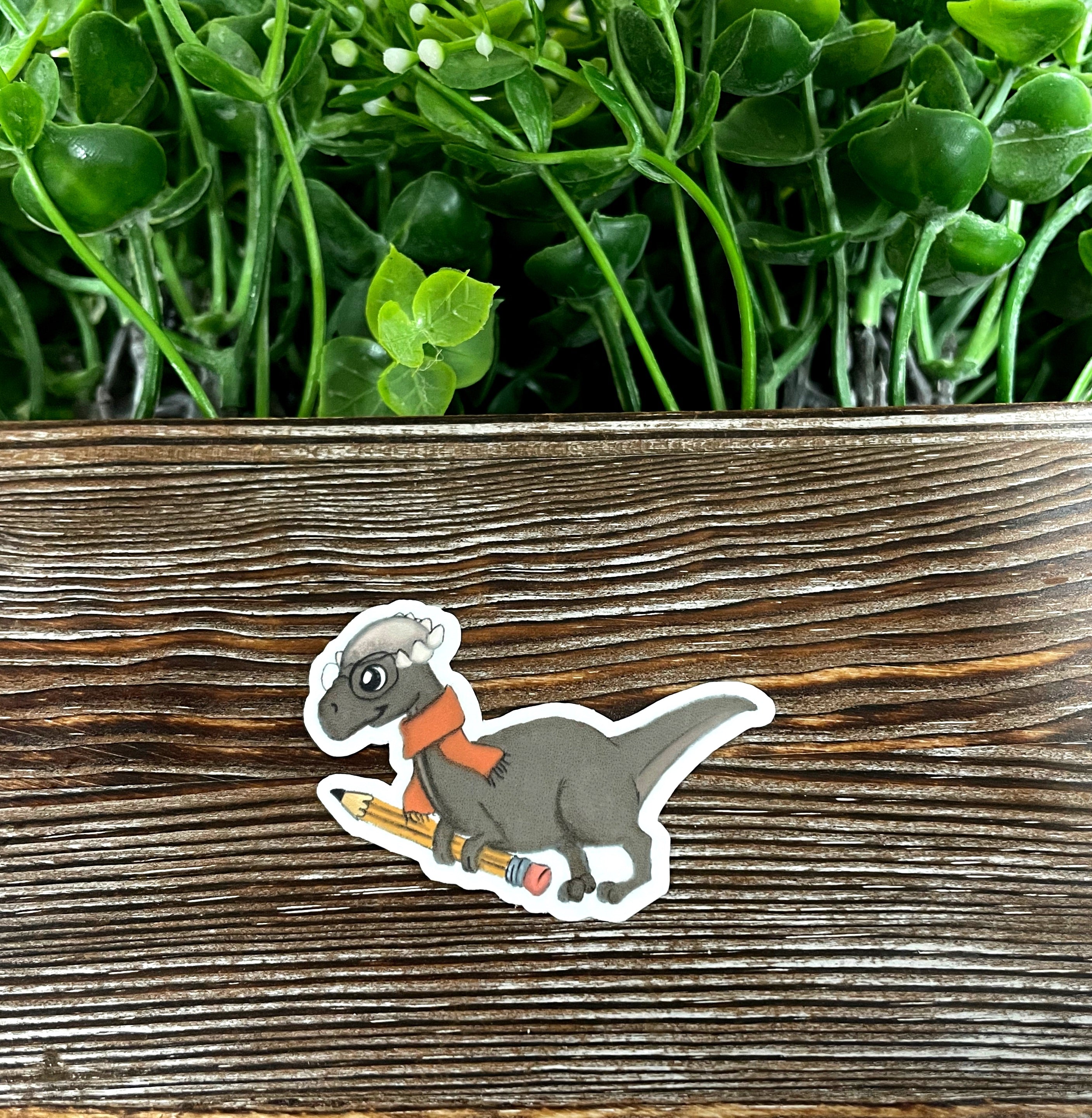 Watercolor Grey Dinosaur die cut sticker on a smooth surface, showcasing vibrant colors and intricate design.