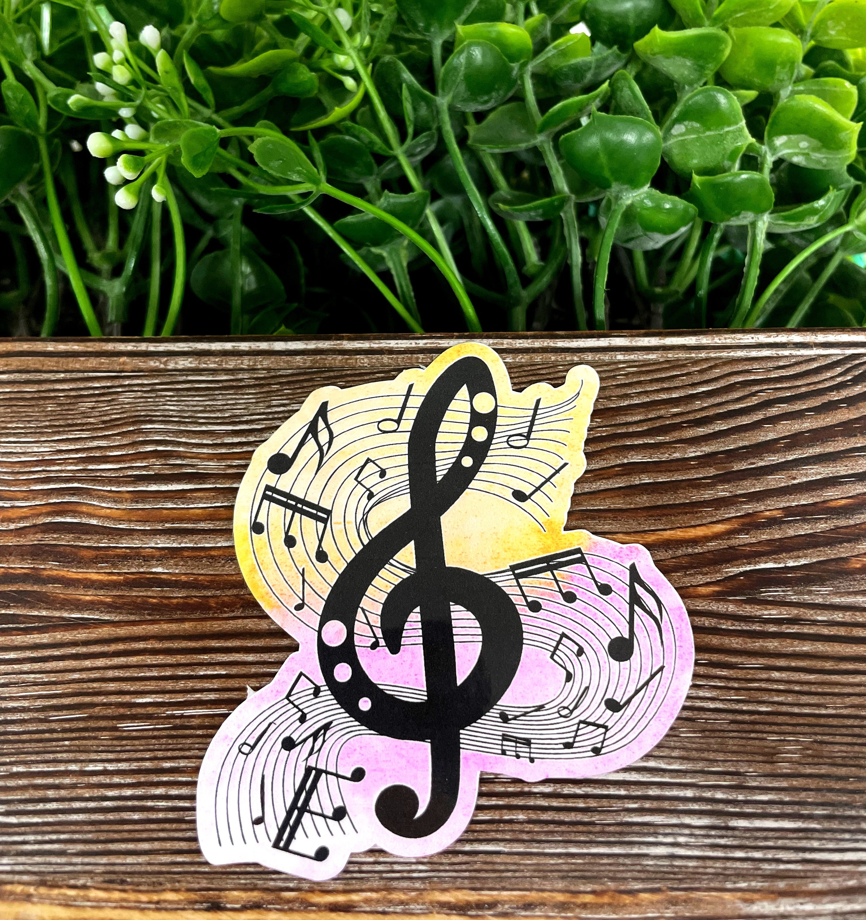 A vibrant watercolor music note sticker showcasing colorful musical notes on a white background, perfect for personalizing items.