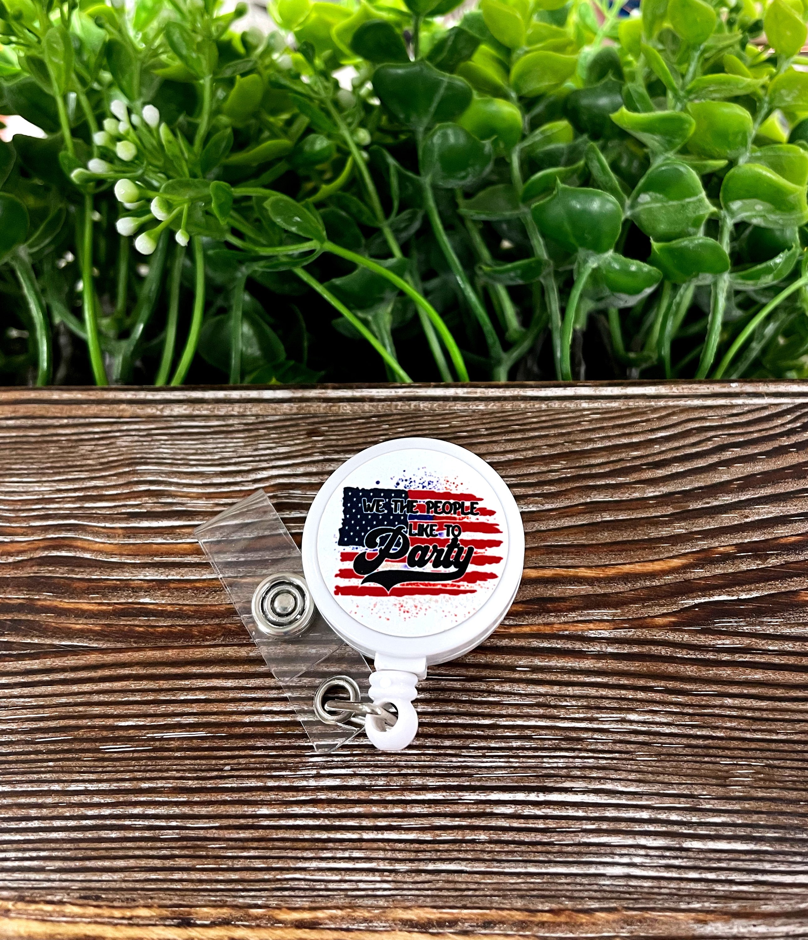 We the People Like to Party retractable badge reel featuring a colorful boho design on a metal blank with a plastic reel.