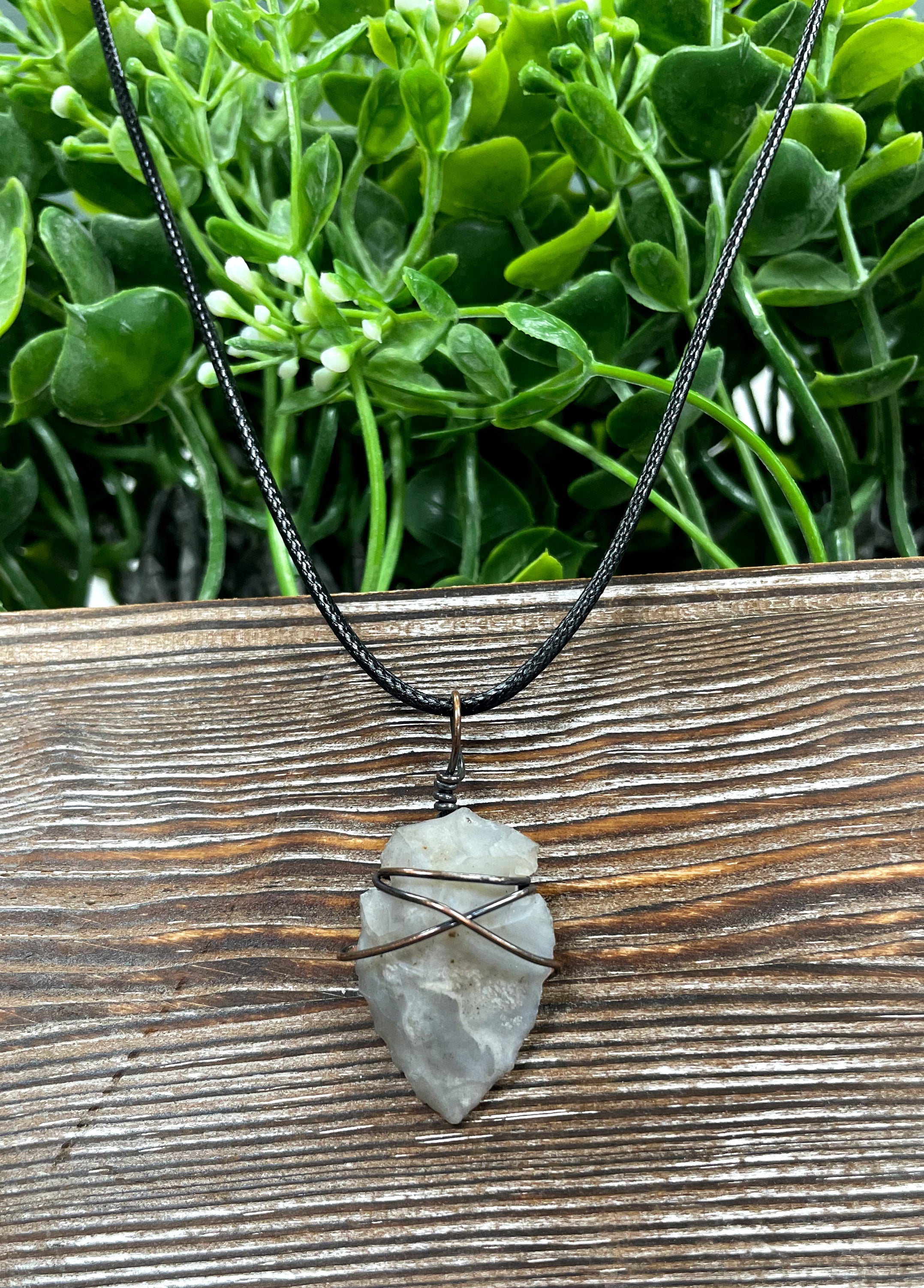 Wire Wrapped Arrowhead Pendant featuring oxidized copper wire on a 21-inch cord, showcasing an antique finish.