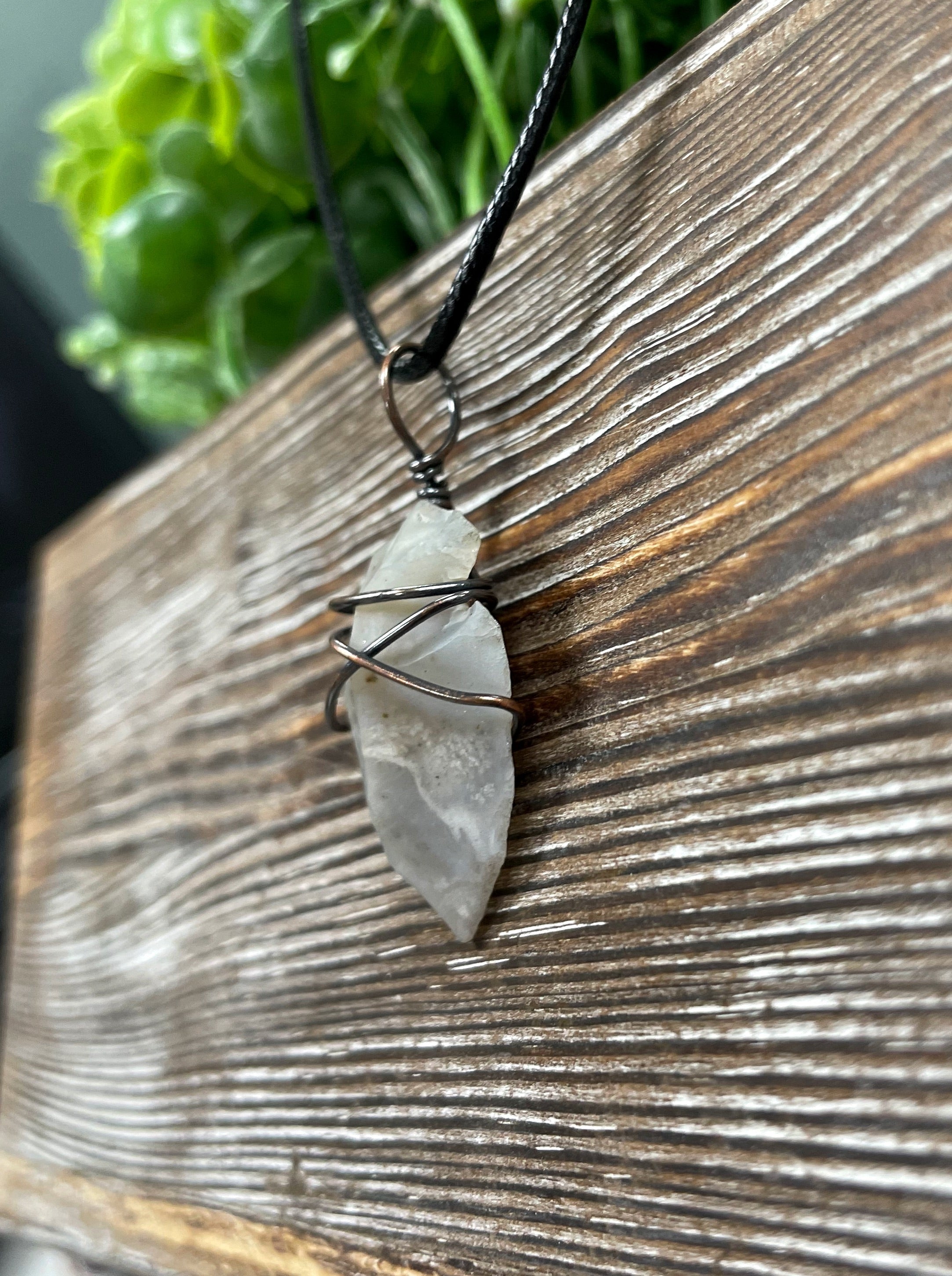 Wire Wrapped Arrowhead Pendant featuring oxidized copper wire on a 21-inch cord, showcasing an antique finish.