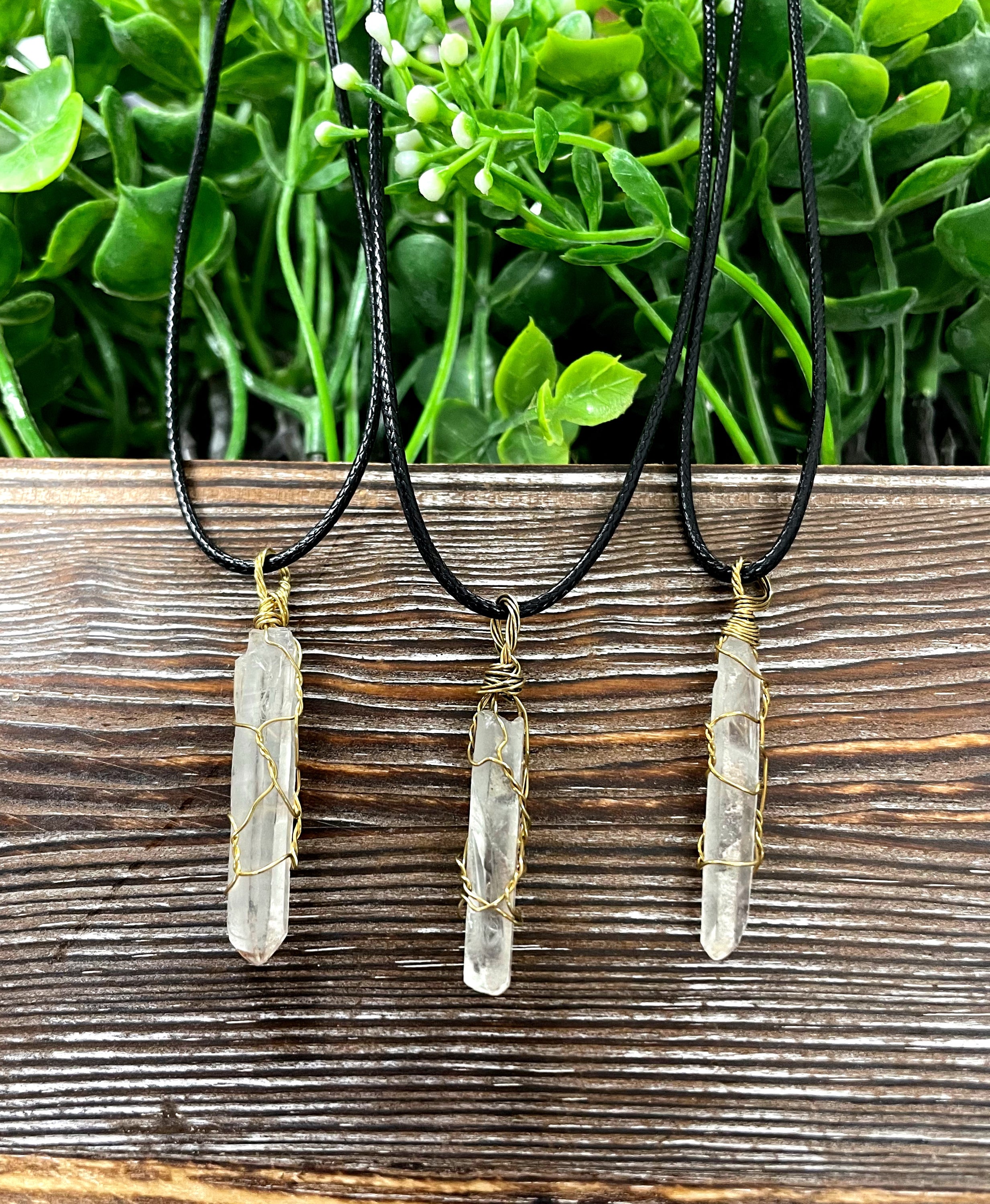 Wire Wrapped Clear Quartz Crystal Pendant with Brass Wire on a 21-inch cord, showcasing its antique finish and natural beauty.