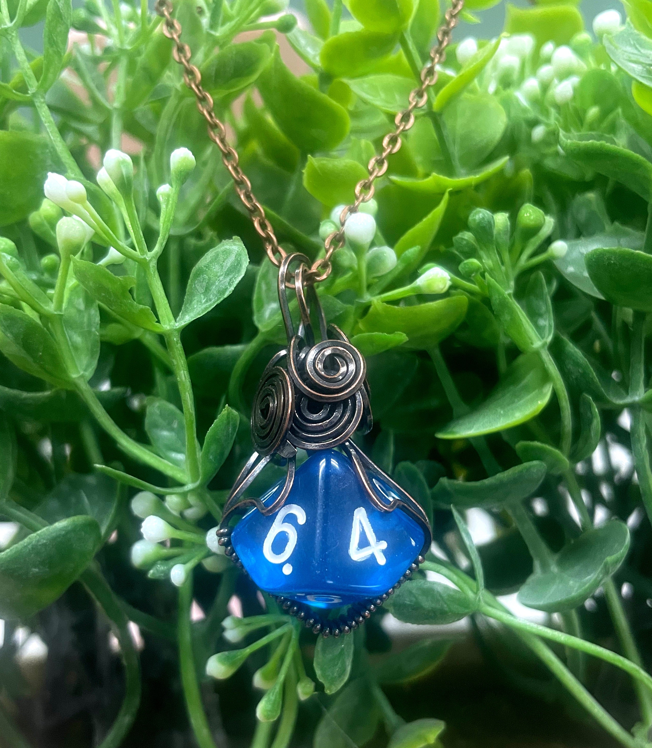 Wire Wrapped D10 Dice Pendant in blue, featuring oxidized copper wire and a suede leather cord, showcasing a unique gaming-inspired design.