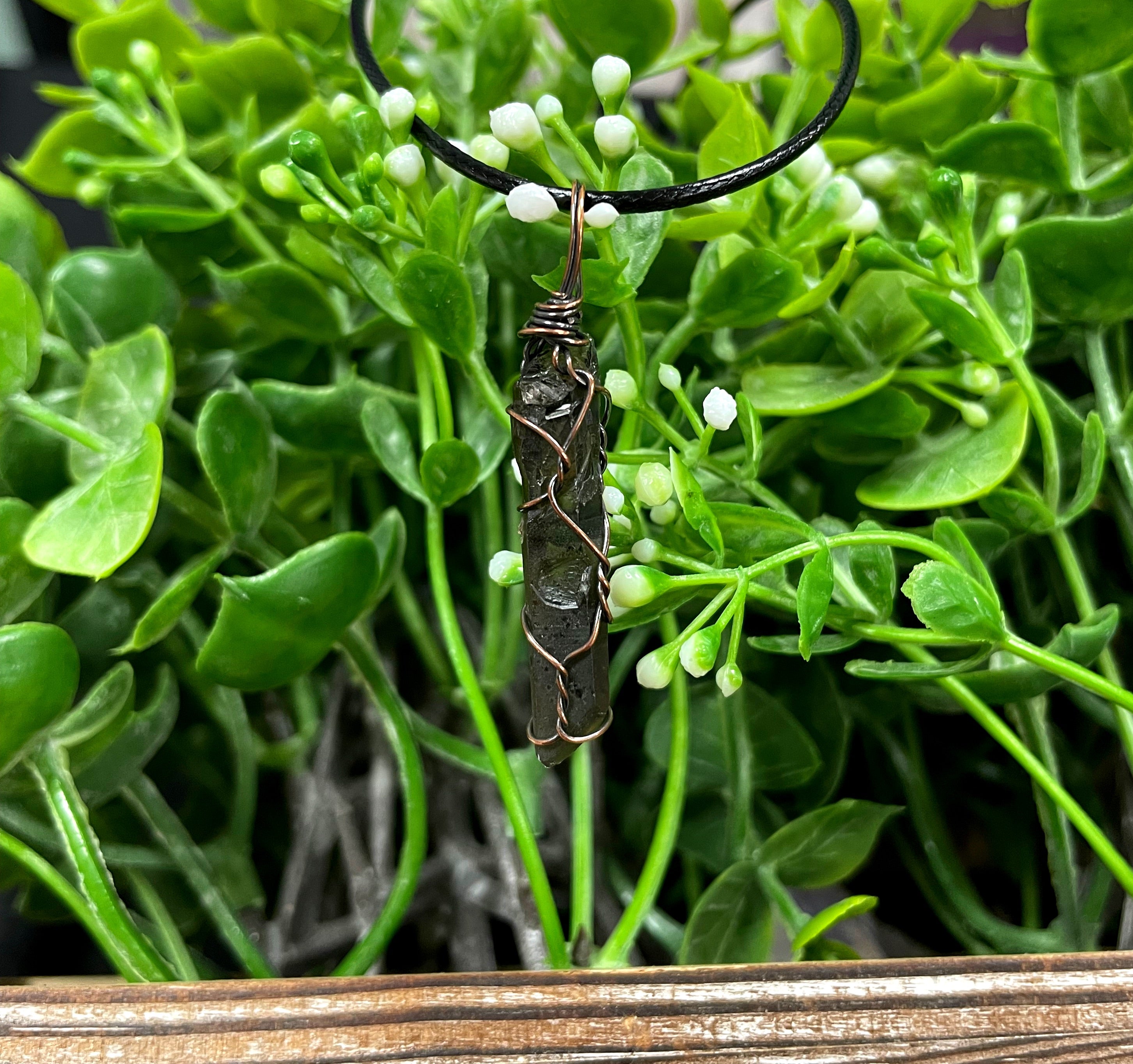 Wire Wrapped Smoky Quartz Crystal Pendant with oxidized copper wire on a 21-inch cord, showcasing its antique look and polished finish.