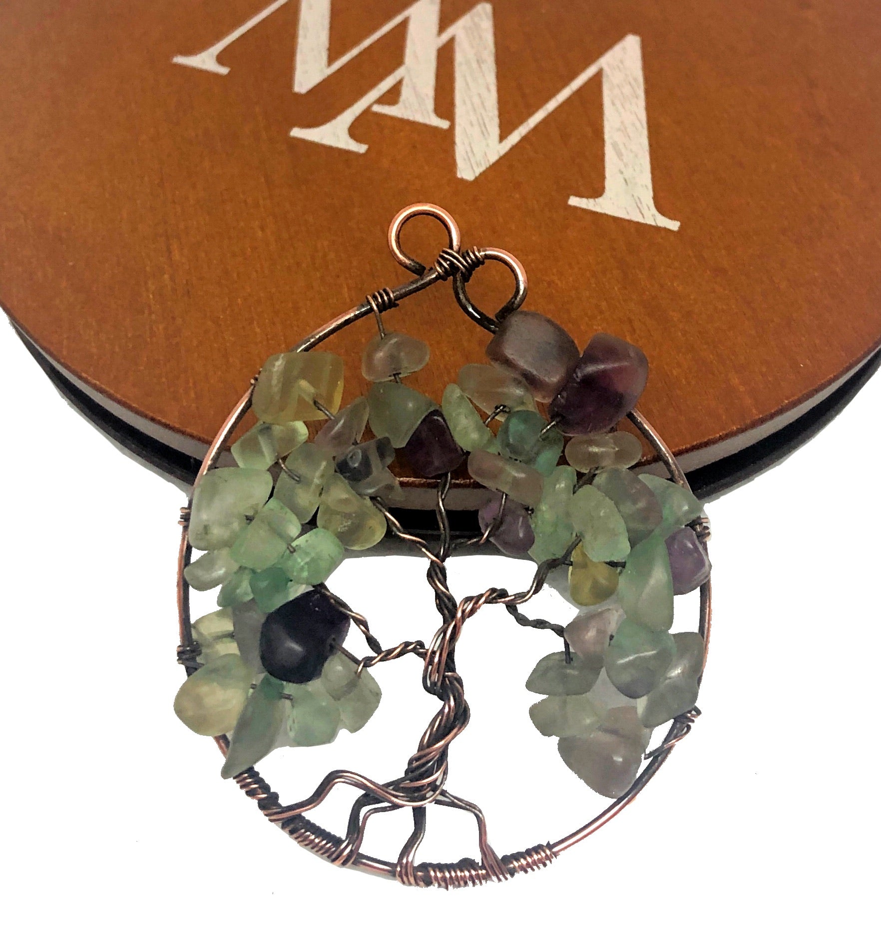 Wire Wrapped Tree of Life Pendant featuring Fluorite gemstones on an 18-inch ball chain, showcasing intricate copper wire design.