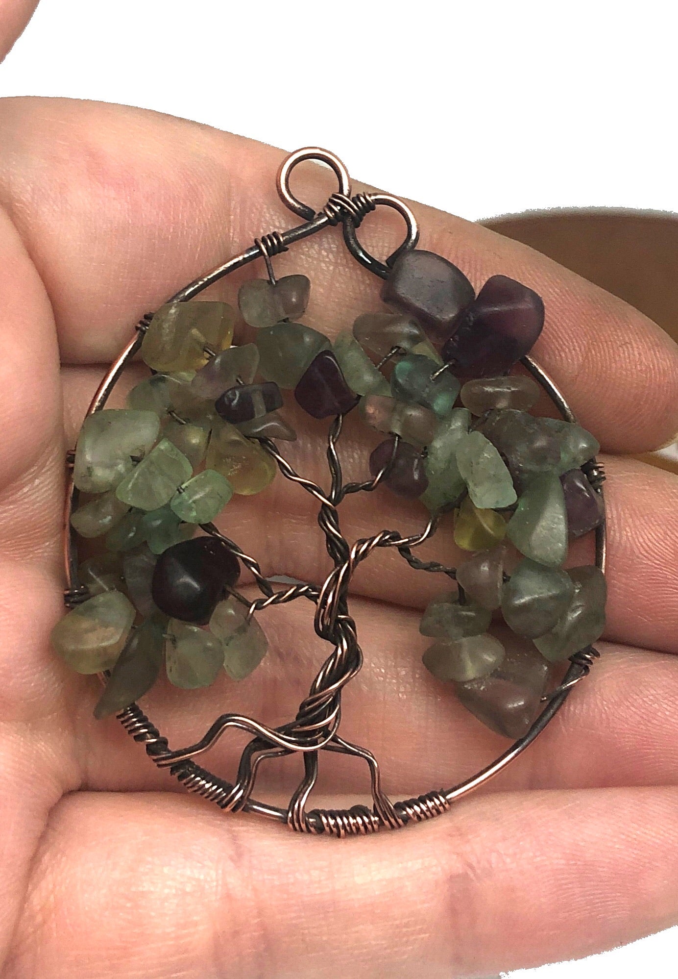 Wire Wrapped Tree of Life Pendant featuring Fluorite gemstones on an 18-inch ball chain, showcasing intricate copper wire design.