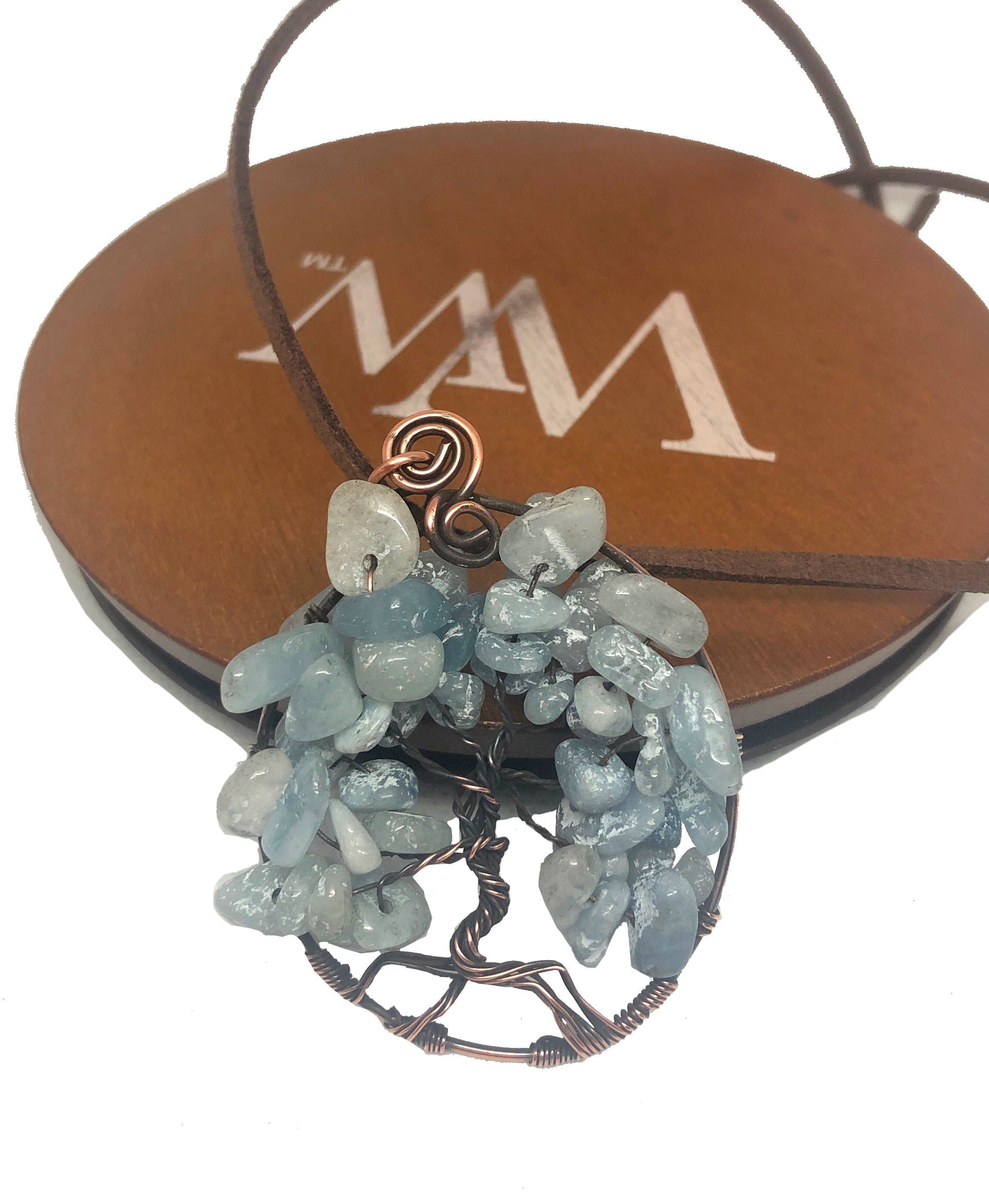 Wire Wrapped Tree of Life Pendant featuring larimar gemstones on a suede leather cord, showcasing intricate oxidized copper wire wrapping.