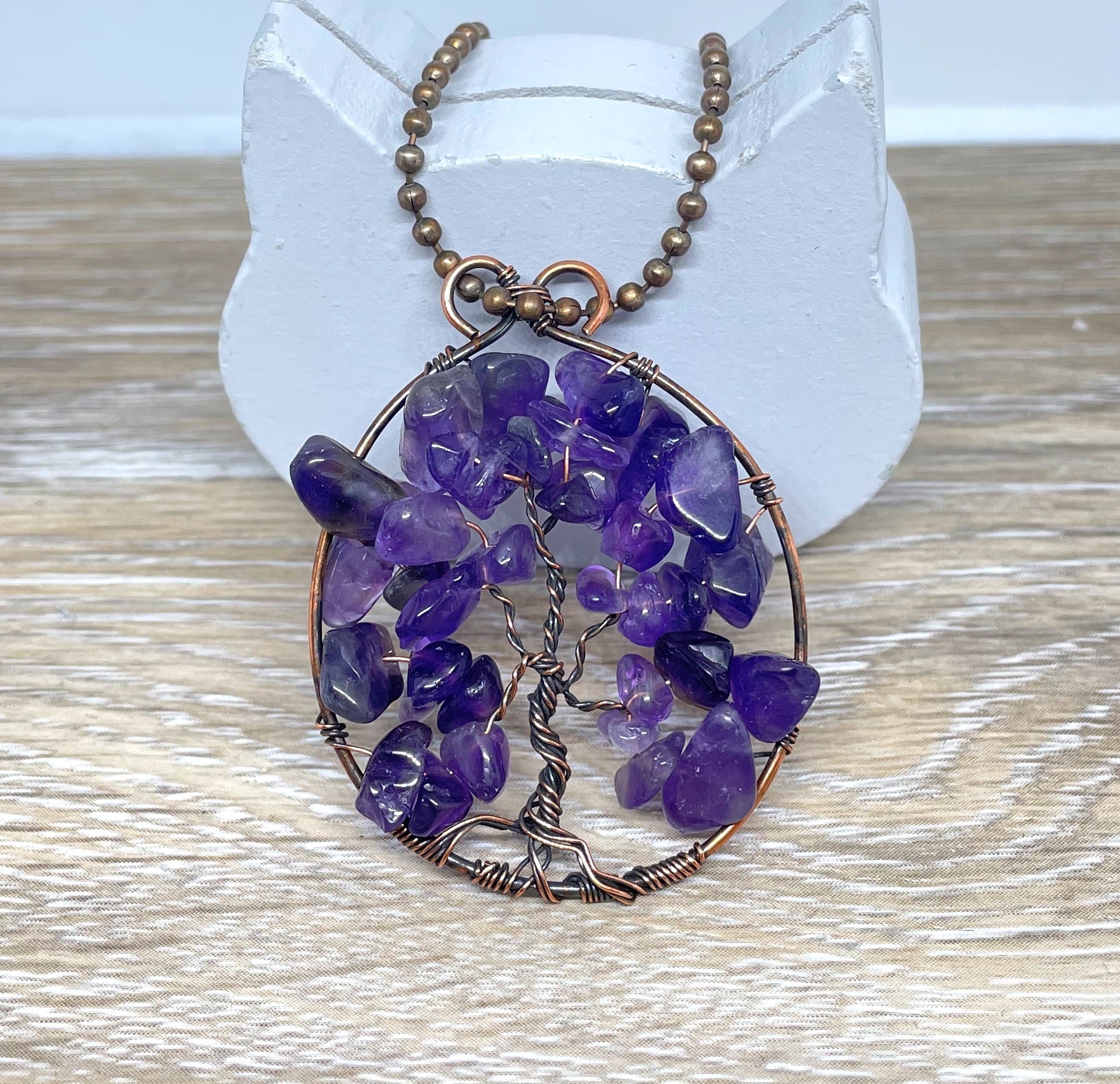 Wire Wrapped Tree of Life Pendant featuring Amethyst gemstones, crafted with oxidized copper wire on an 18-inch ball chain.