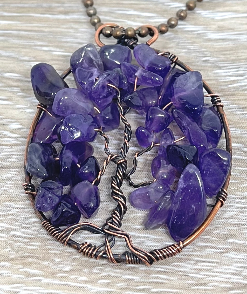 Wire Wrapped Tree of Life Pendant featuring Amethyst gemstones, crafted with oxidized copper wire on an 18-inch ball chain.