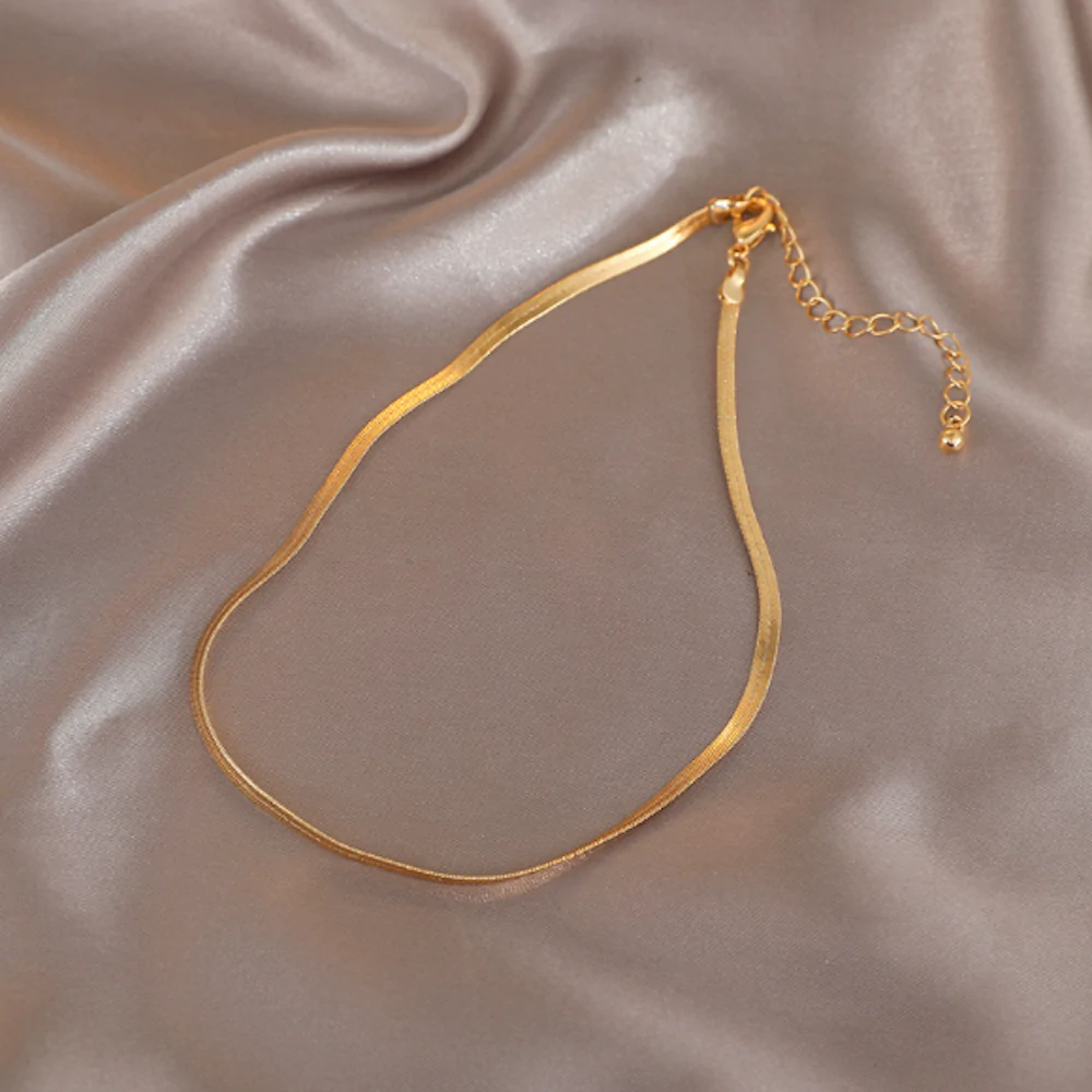 A beautiful Womens Herringbone Chain Necklace featuring a gold plated alloy design, showcasing its elegant herringbone pattern.