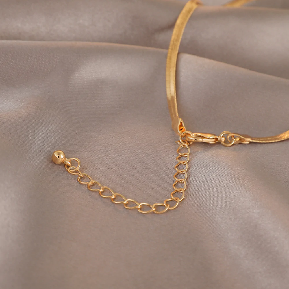 A beautiful Womens Herringbone Chain Necklace featuring a gold plated alloy design, showcasing its elegant herringbone pattern.