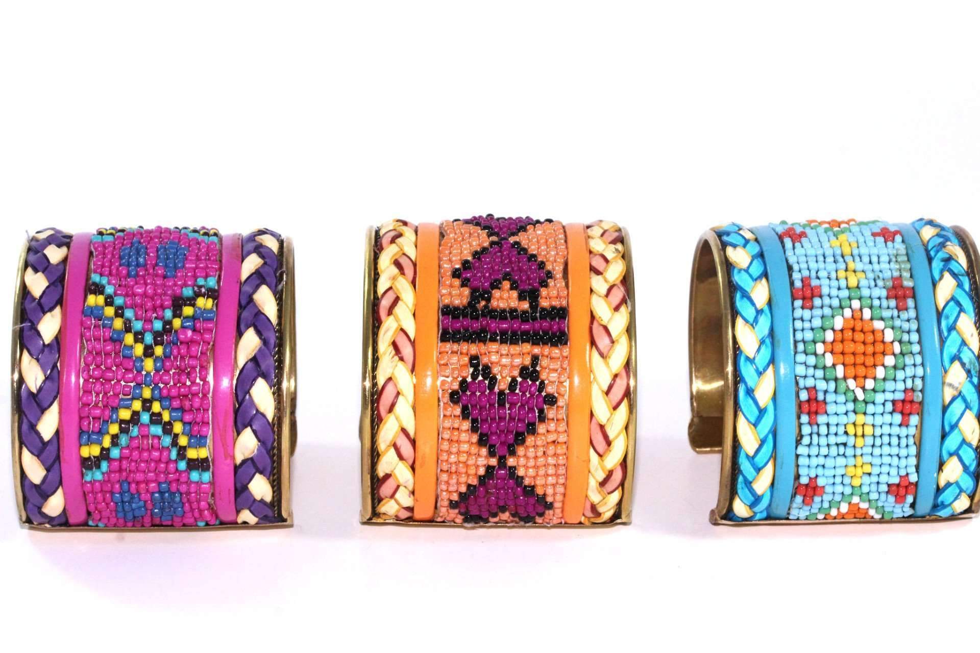 Colorful beaded cuff bangles featuring heart and tribal patterns, adjustable for a perfect fit.