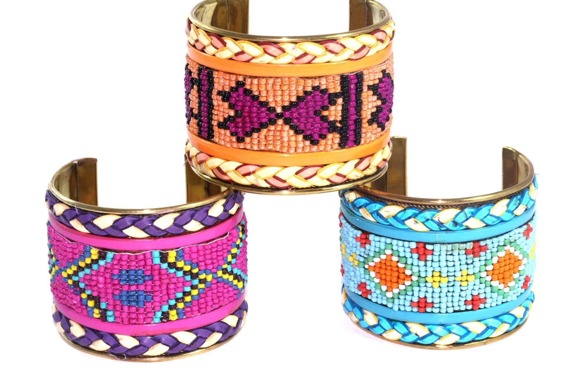 Colorful beaded cuff bangles featuring heart and tribal patterns, adjustable for a perfect fit.