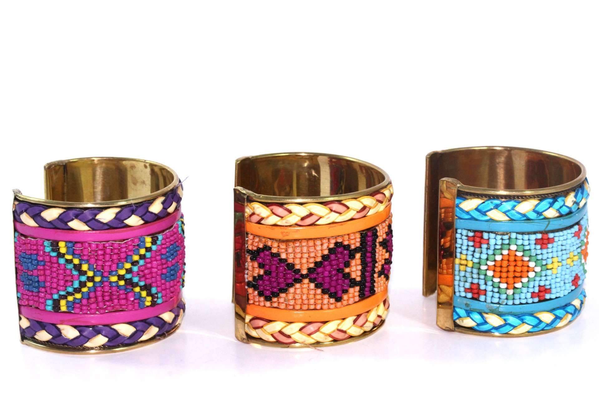 Colorful beaded cuff bangles featuring heart and tribal patterns, adjustable for a perfect fit.